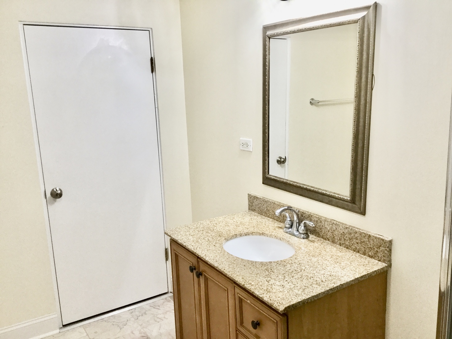2016 Maple Avenue Northbrook, IL 60062 - Photo 16 of 32 a bathroom with a granite countertop sink and a mirror