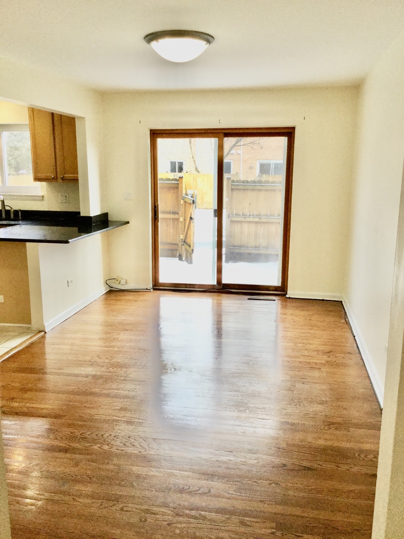 2016 Maple Avenue Northbrook, IL 60062 - Photo 10 of 32 a view of empty room with wooden floor and fan