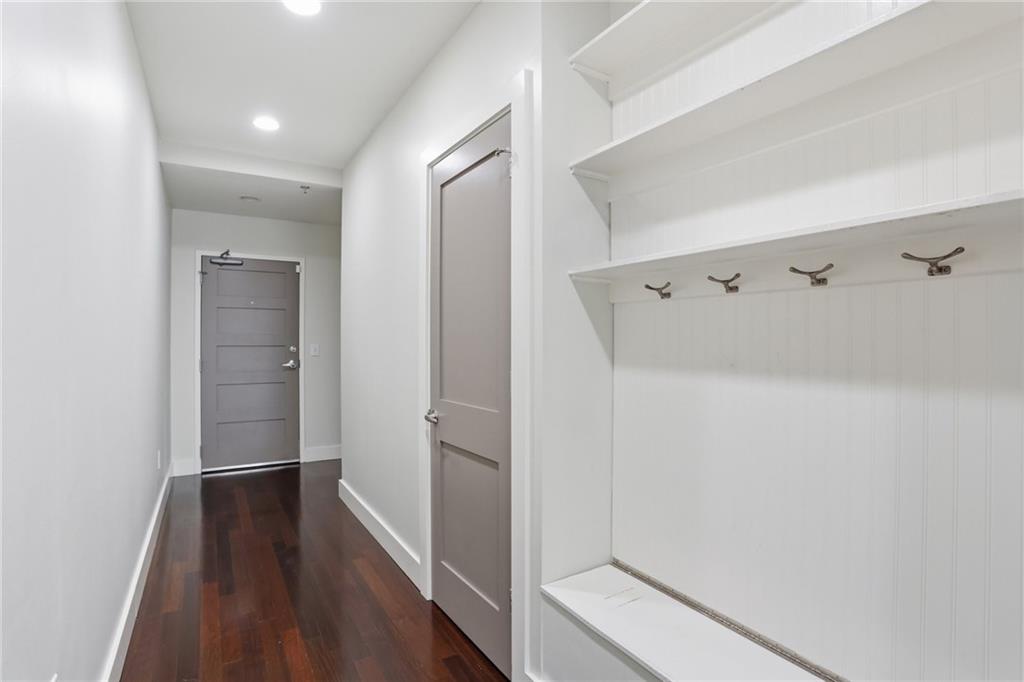 1100 Howell Mill Road Northwest, Unit 608 Atlanta, GA 30318 - Photo 2 of 37 a view of hallway with wooden floor
