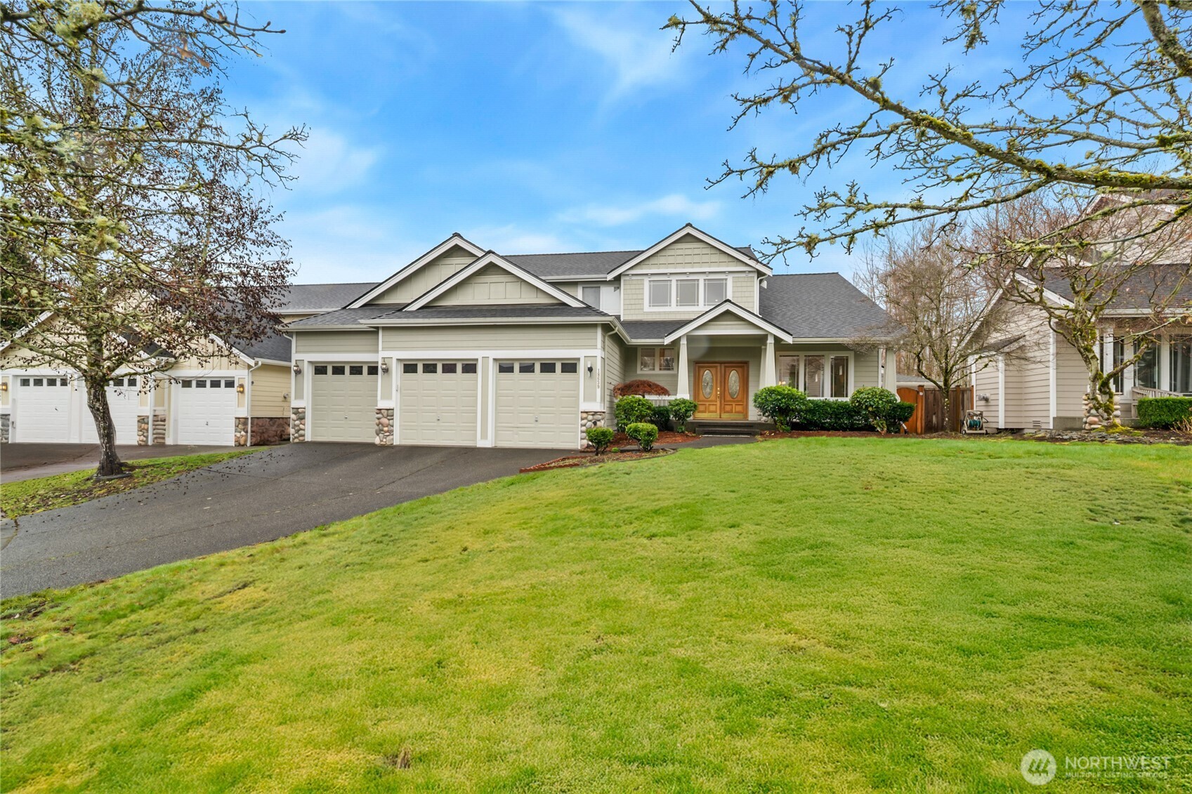 18639 175th Avenue Southeast Renton, WA 98058 - Photo 1 of 37 a front view of a house with a garden