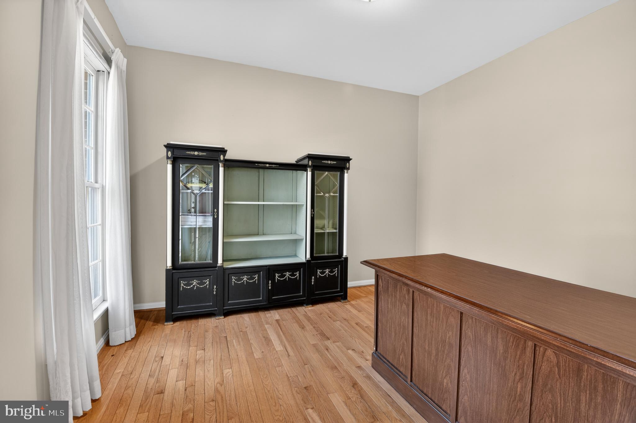 13106 Quail Creek Court Silver Spring, MD 20904 - Photo 11 of 43 a view of a room with wooden floor and windows