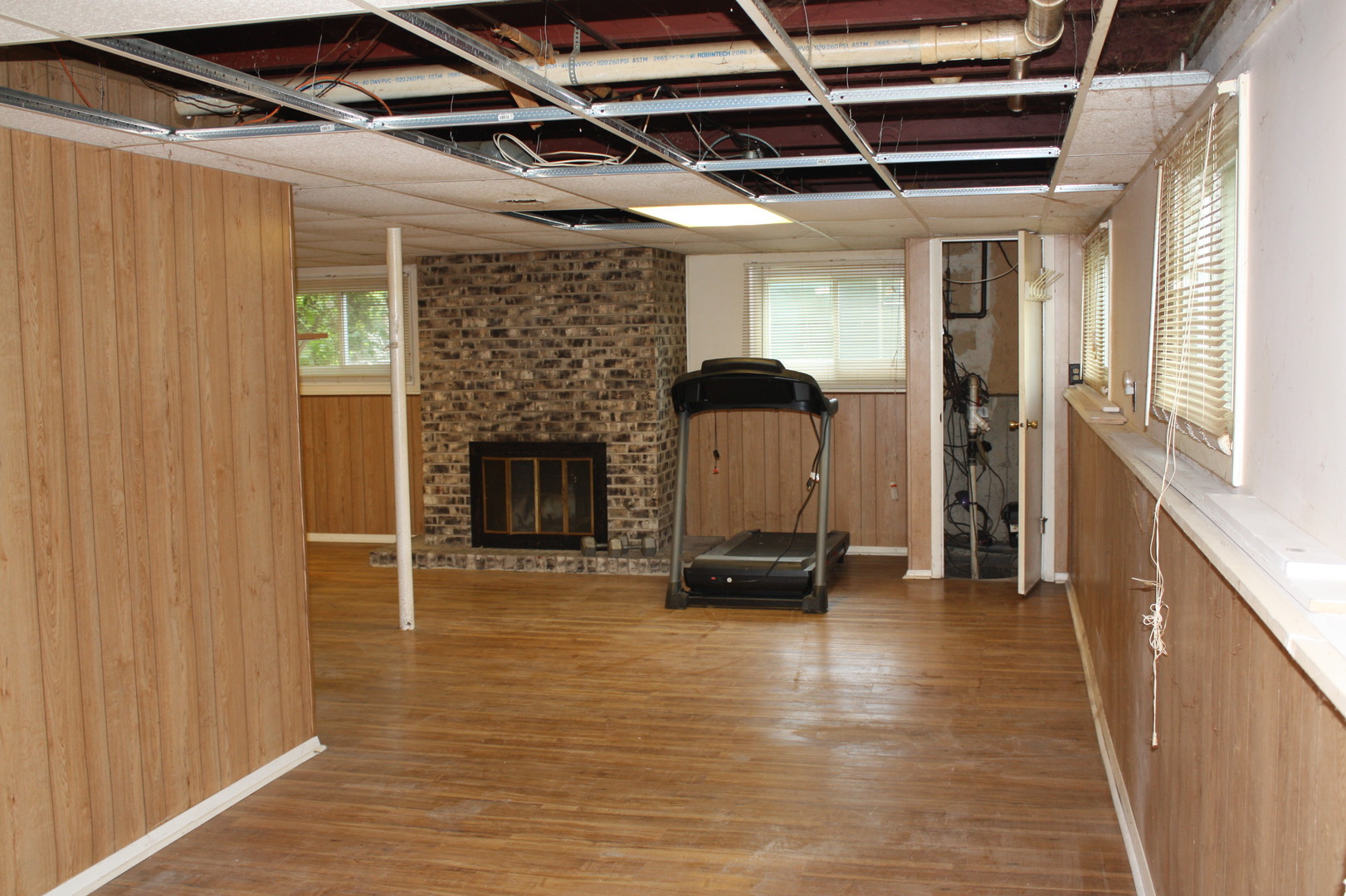 345 Souwanas Trail Algonquin, IL 60102 - Photo 12 of 16 a view of empty room with wooden floor and fireplace