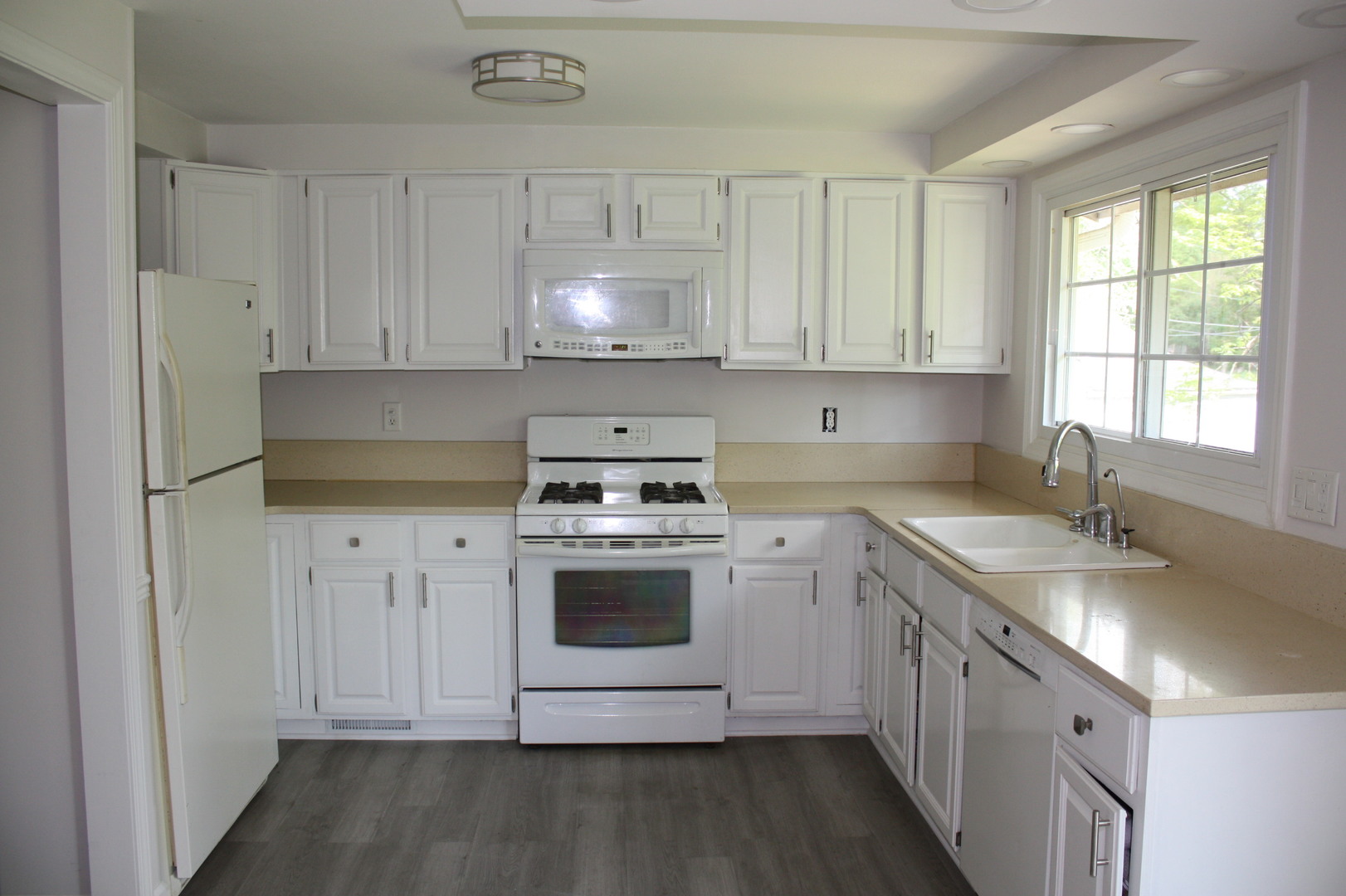 345 Souwanas Trail Algonquin, IL 60102 - Photo 3 of 16 a kitchen with stainless steel appliances granite countertop a sink stove and refrigerator