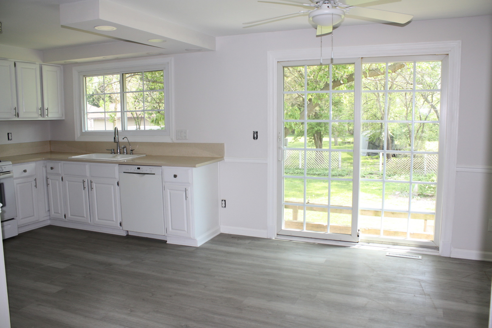 345 Souwanas Trail Algonquin, IL 60102 - Photo 4 of 16 a kitchen with granite countertop a large window sink and cabinets