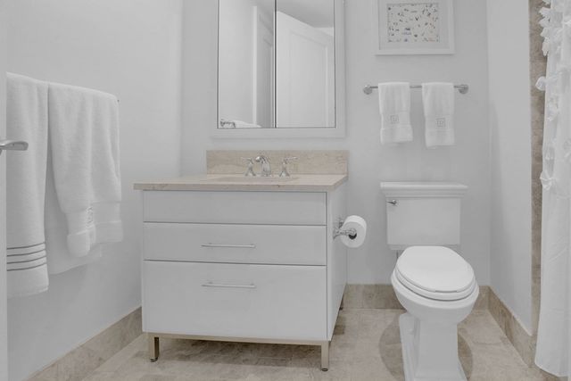 a bathroom with a toilet and a sink