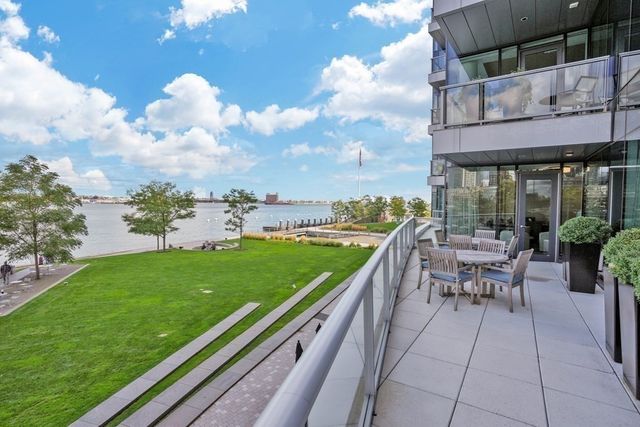 a view of a patio with a table and chairs