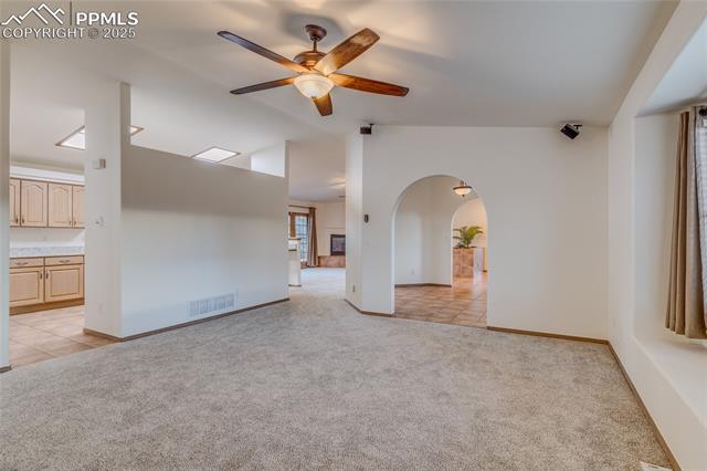 7501 Tudor Road Colorado Springs, CO 80919 - Photo 15 of 48 Living room with dining room to the right and kitchen on the left