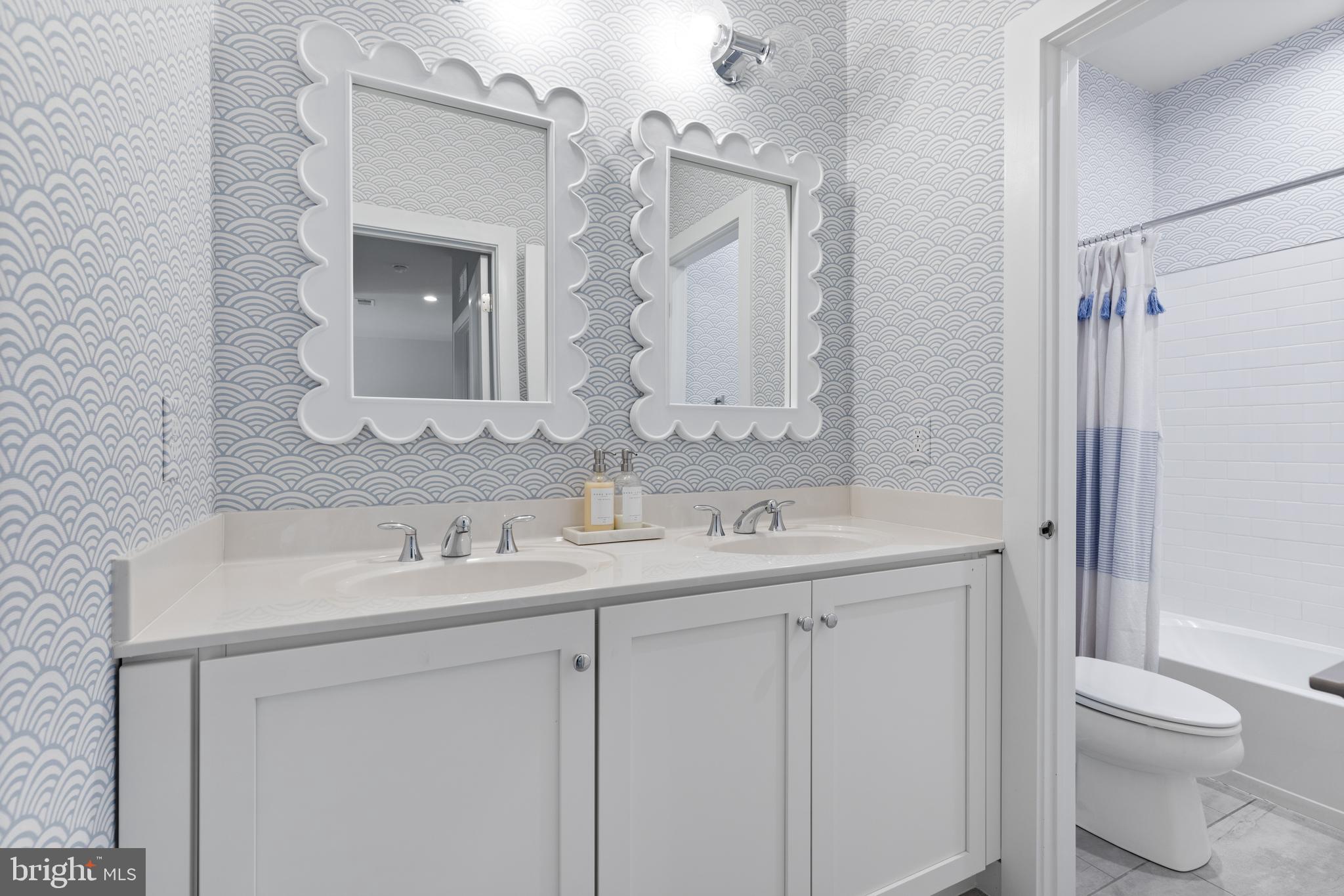662 Levering Street Blue Bell, PA 19422 - Photo 20 of 31 a bathroom with a sink a toilet and a mirror
