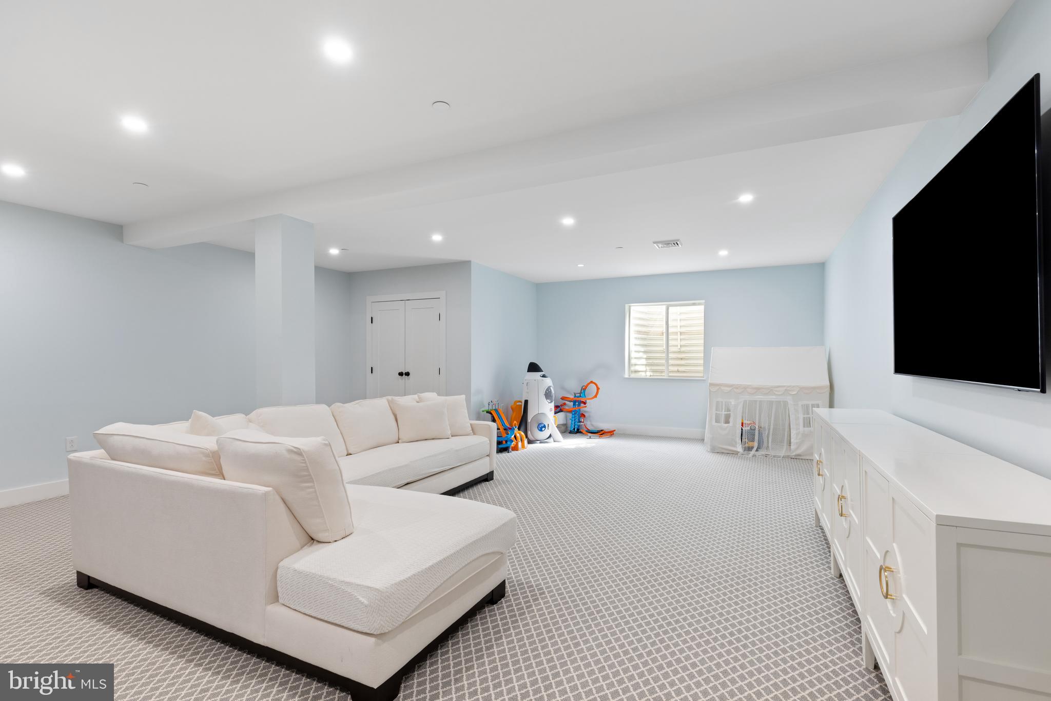 662 Levering Street Blue Bell, PA 19422 - Photo 22 of 31 a living room with furniture a flat screen tv and white walls