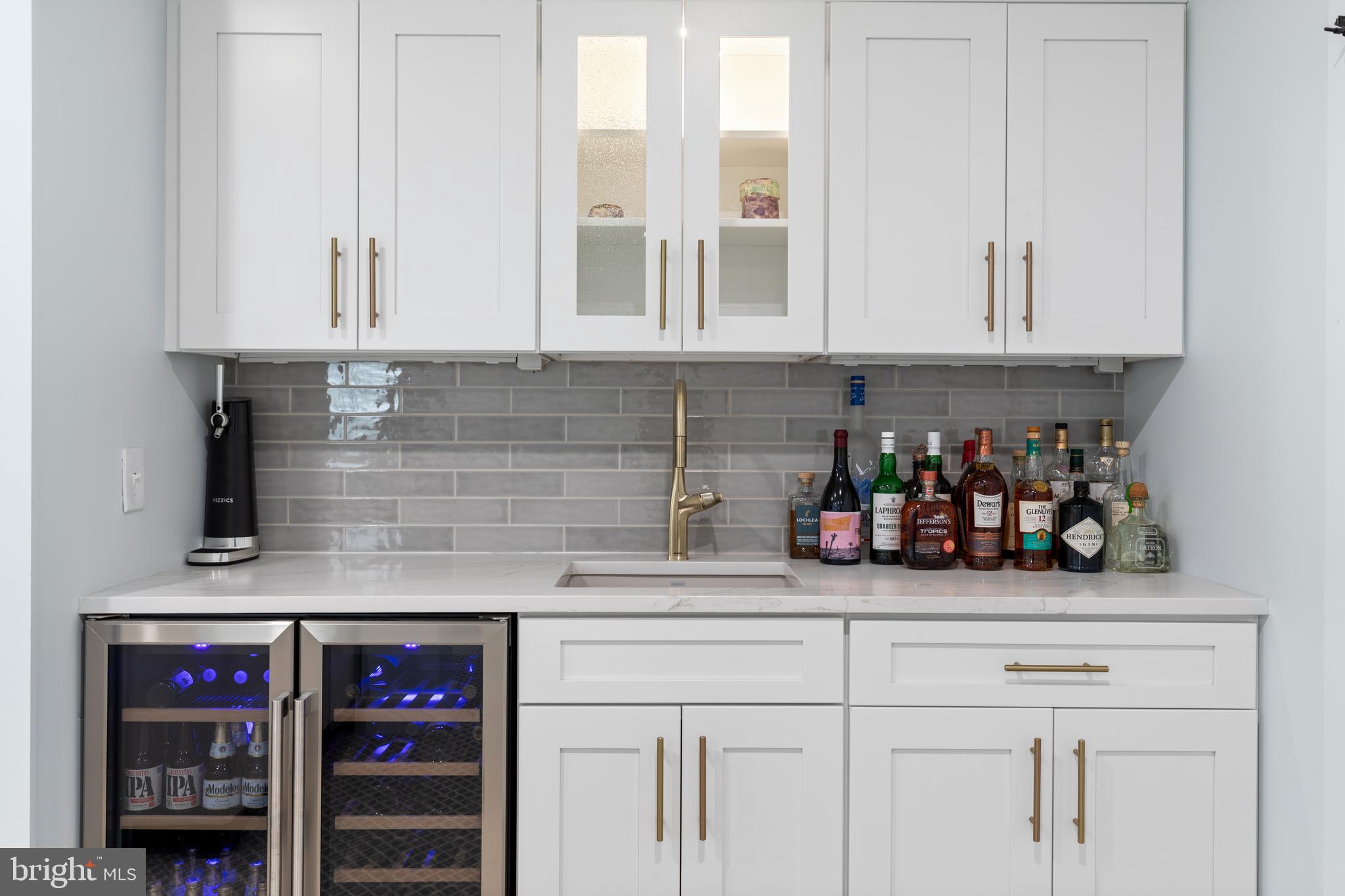 662 Levering Street Blue Bell, PA 19422 - Photo 24 of 31 a kitchen with stainless steel appliances white cabinets and a sink