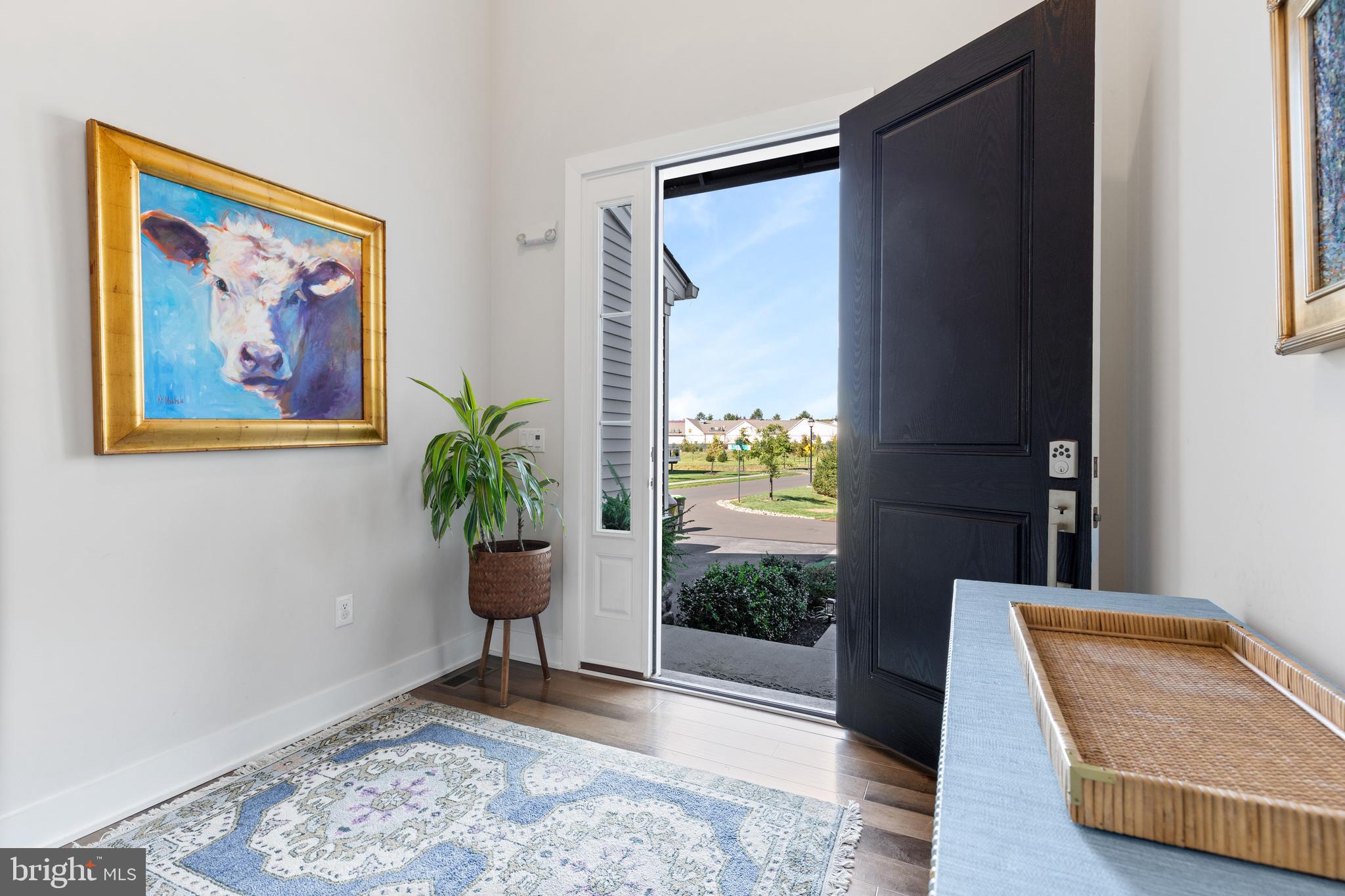 662 Levering Street Blue Bell, PA 19422 - Photo 27 of 31 a view of a hallway with wooden floor and a potted plant