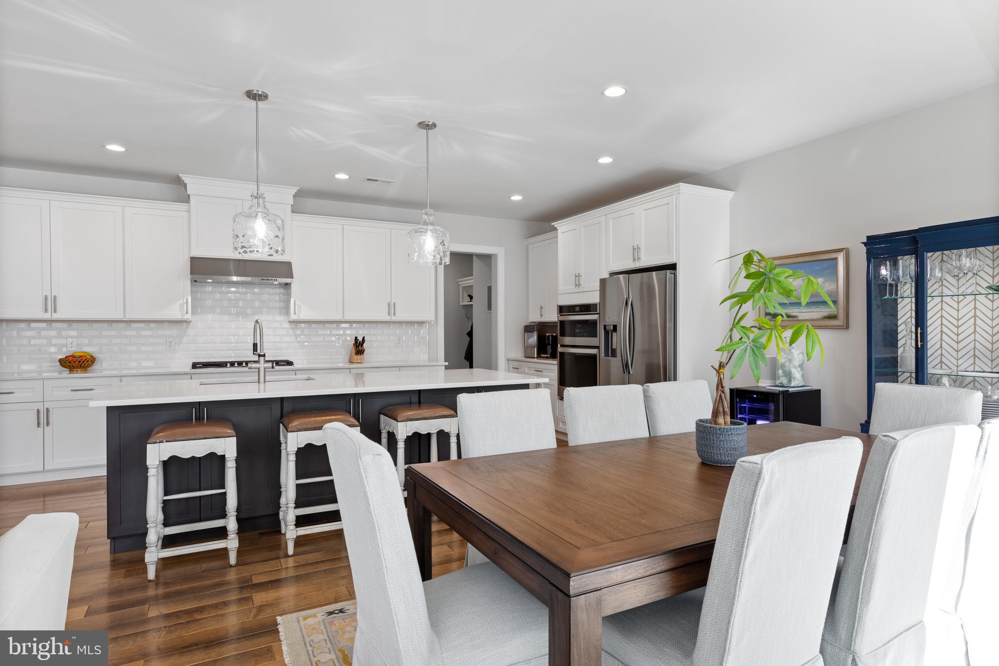 662 Levering Street Blue Bell, PA 19422 - Photo 5 of 31 a large kitchen with kitchen island a dining table and chairs