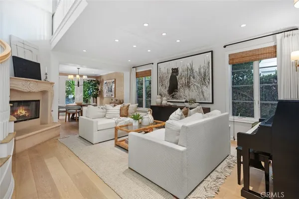 a living room with furniture fireplace and a flat screen tv