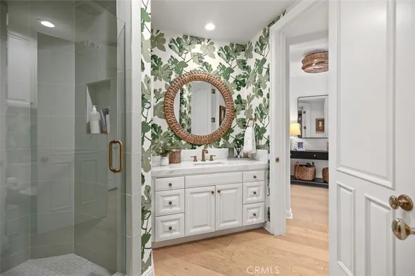 a utility room with stainless steel appliances cabinets and a window