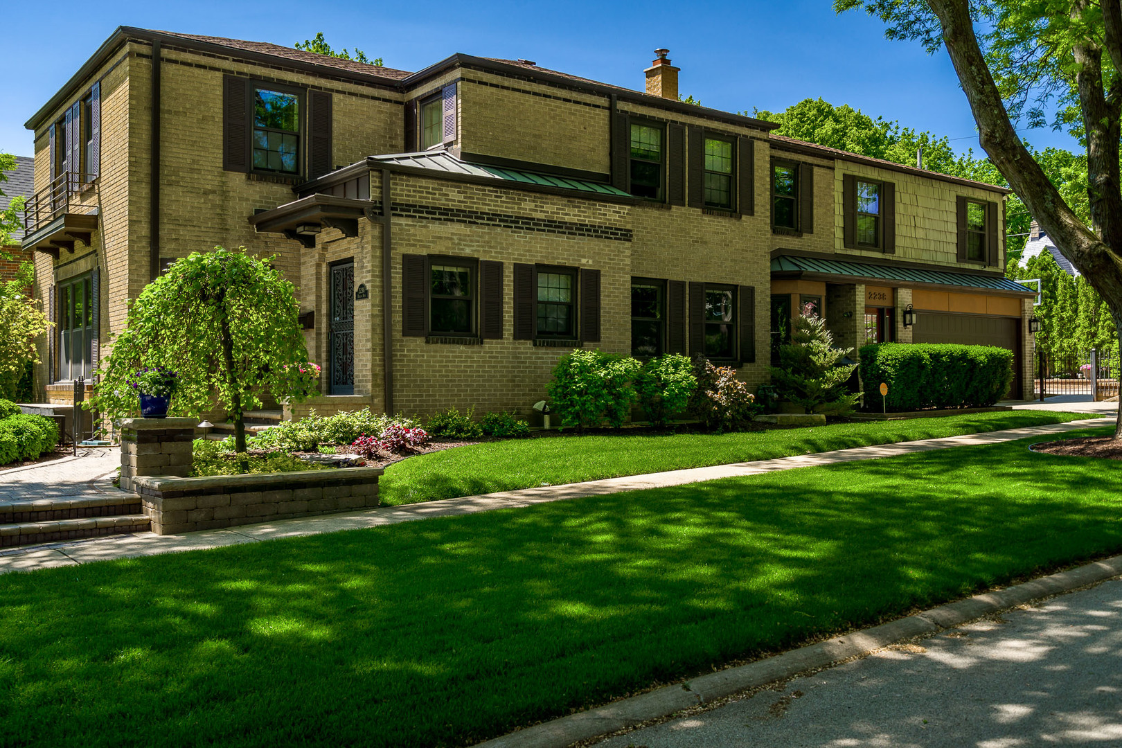 2238 Harlem Boulevard Rockford, IL 61103 - Photo 1 of 82 a front view of a house with a garden