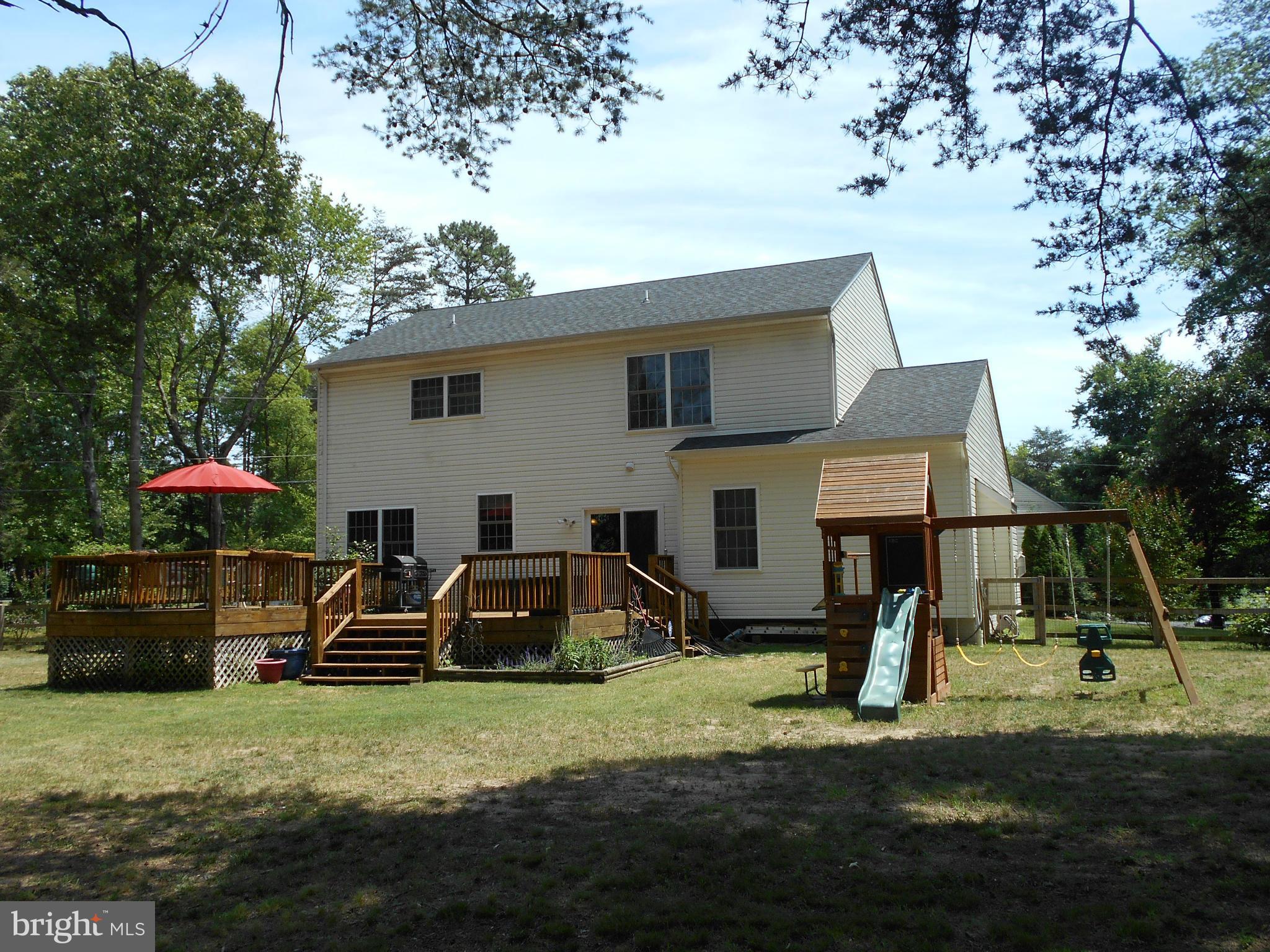 7726 Locust Wood Road Severn, MD 21144 - Photo 22 of 23 a front view of a house with a yard