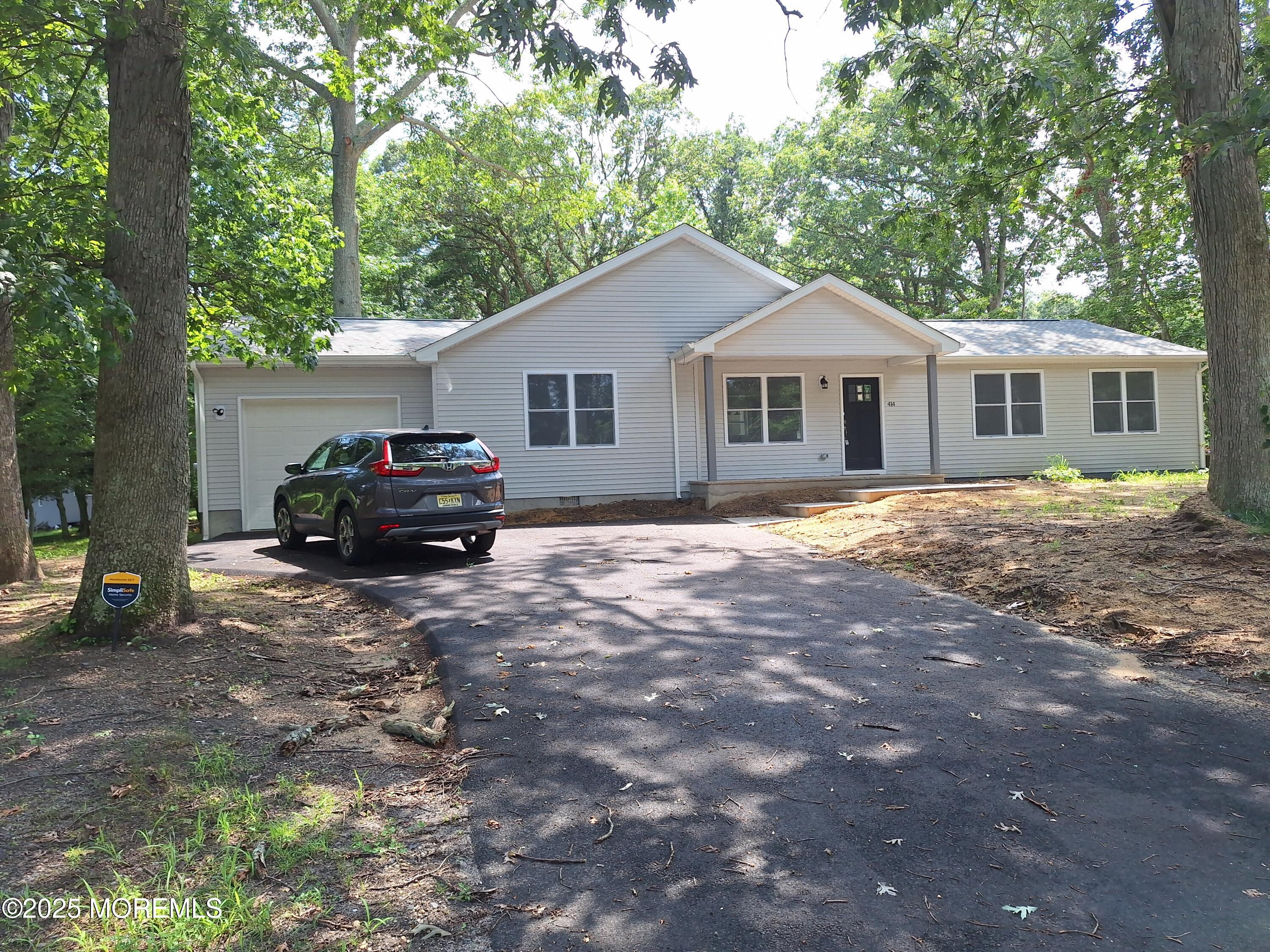 414 Oak Tree Road Freehold, NJ 07728 - Photo 1 of 25 a house view with a outdoor space