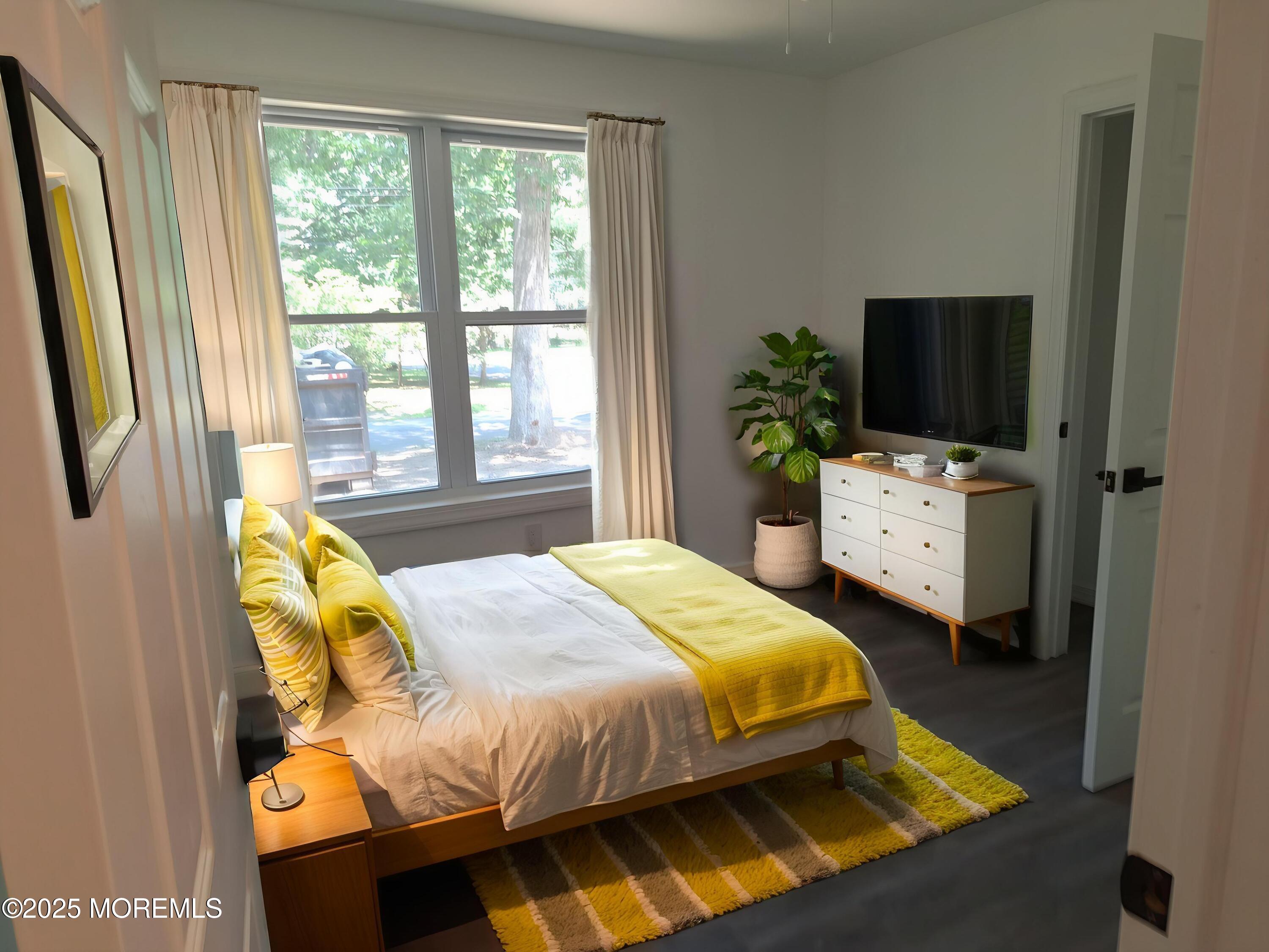 414 Oak Tree Road Freehold, NJ 07728 - Photo 16 of 25 a bedroom with a bed and a window