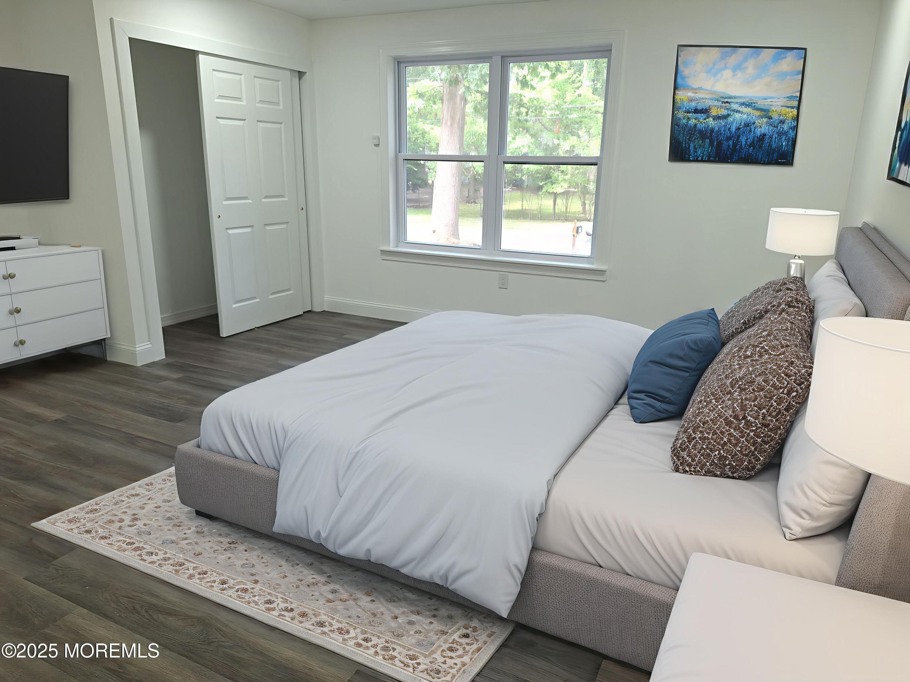 414 Oak Tree Road Freehold, NJ 07728 - Photo 17 of 25 a bedroom with a bed and flat screen tv