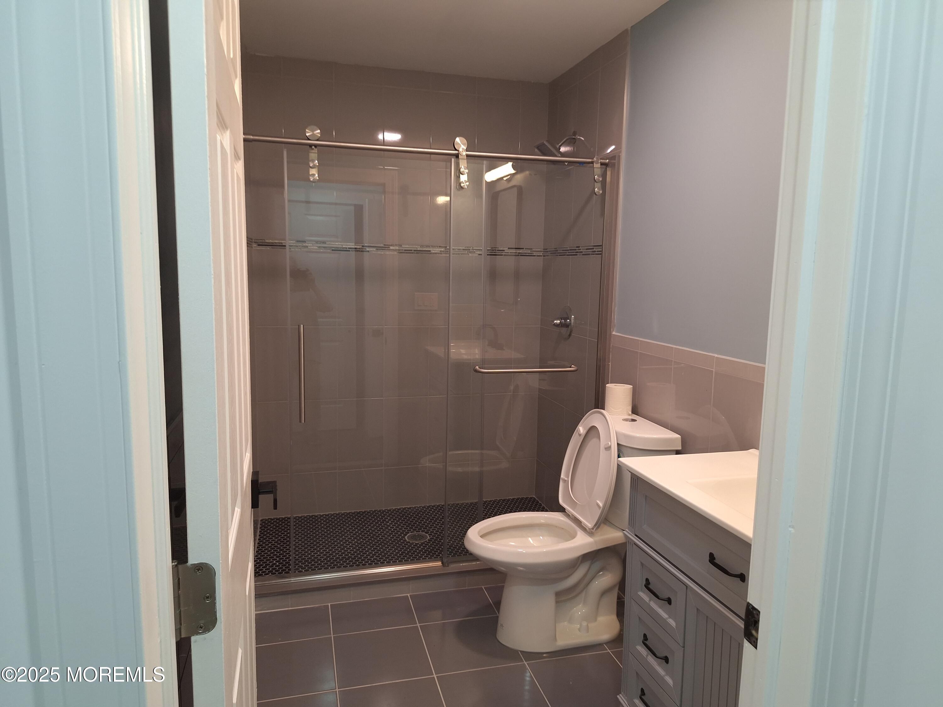 414 Oak Tree Road Freehold, NJ 07728 - Photo 19 of 25 a bathroom with a toilet and a shower