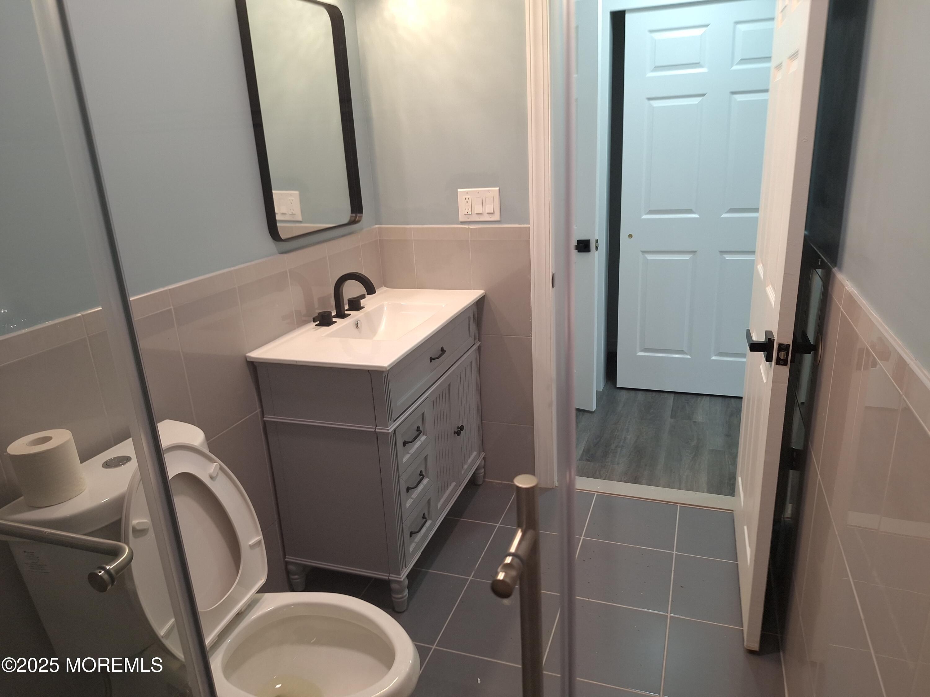 414 Oak Tree Road Freehold, NJ 07728 - Photo 20 of 25 a bathroom with a sink toilet and shower