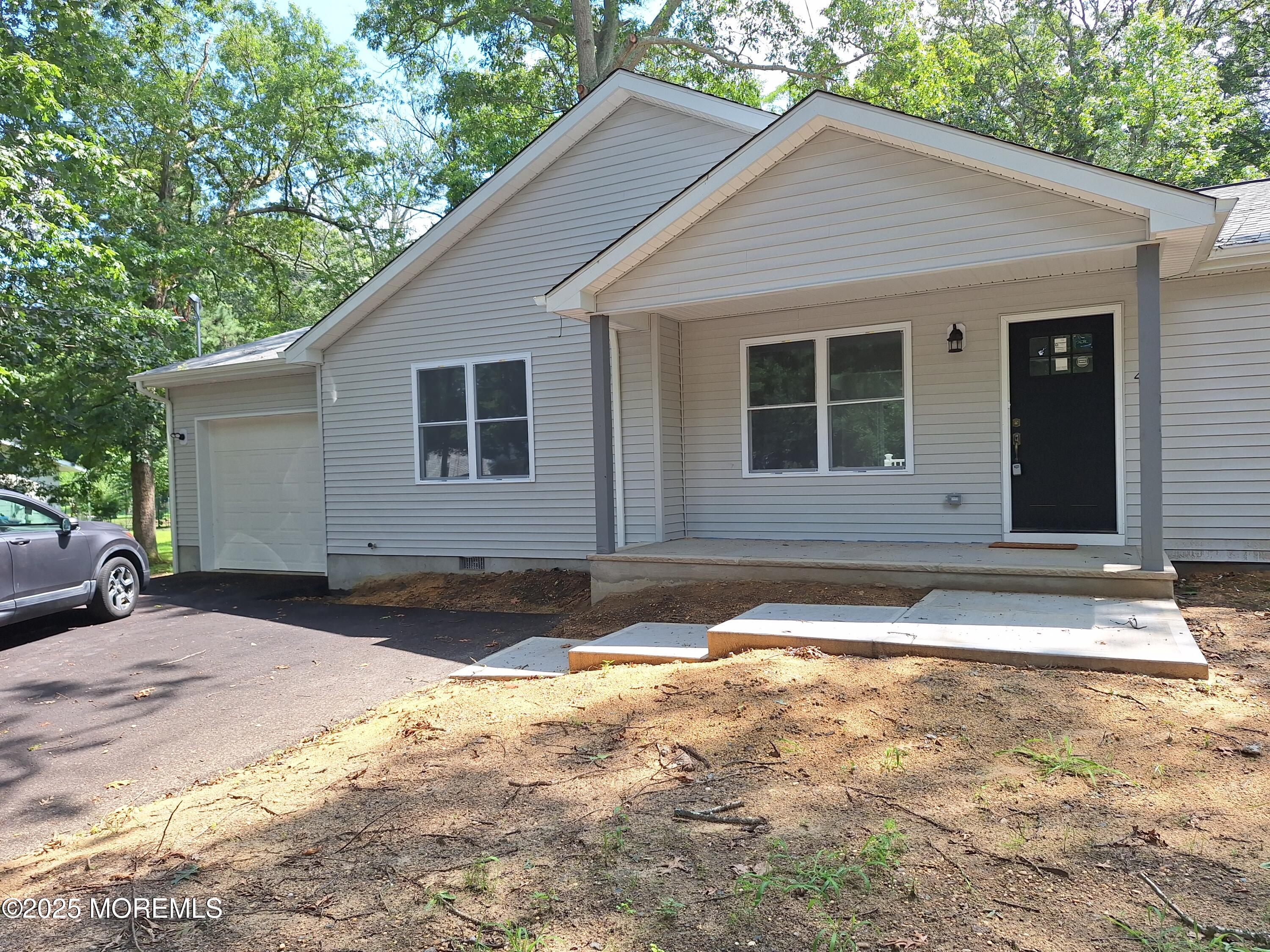 414 Oak Tree Road Freehold, NJ 07728 - Photo 2 of 25 a front view of a house