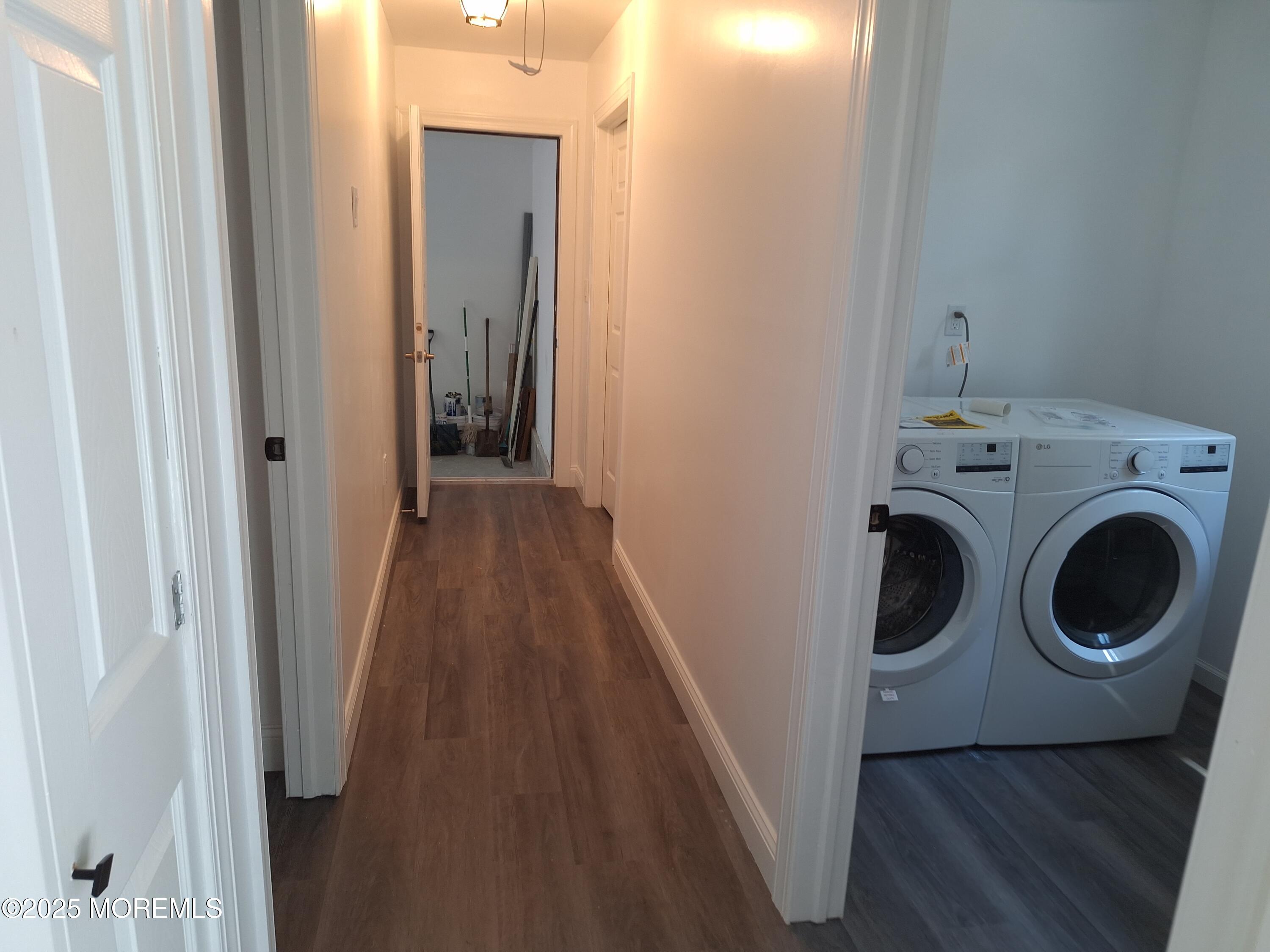 414 Oak Tree Road Freehold, NJ 07728 - Photo 21 of 25 a view of a hallway with washer and dryer