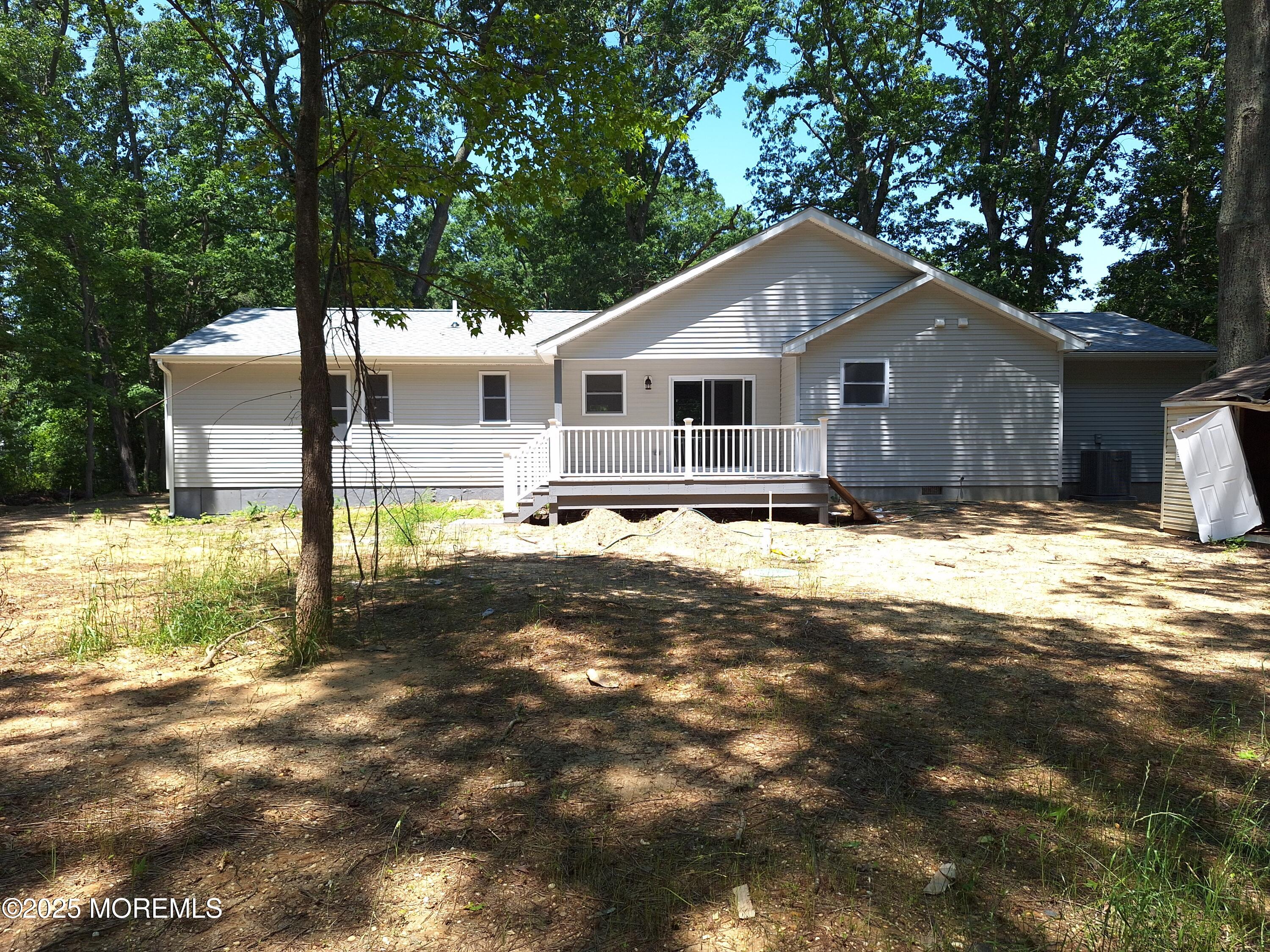 414 Oak Tree Road Freehold, NJ 07728 - Photo 23 of 25 a front view of a house with a yard