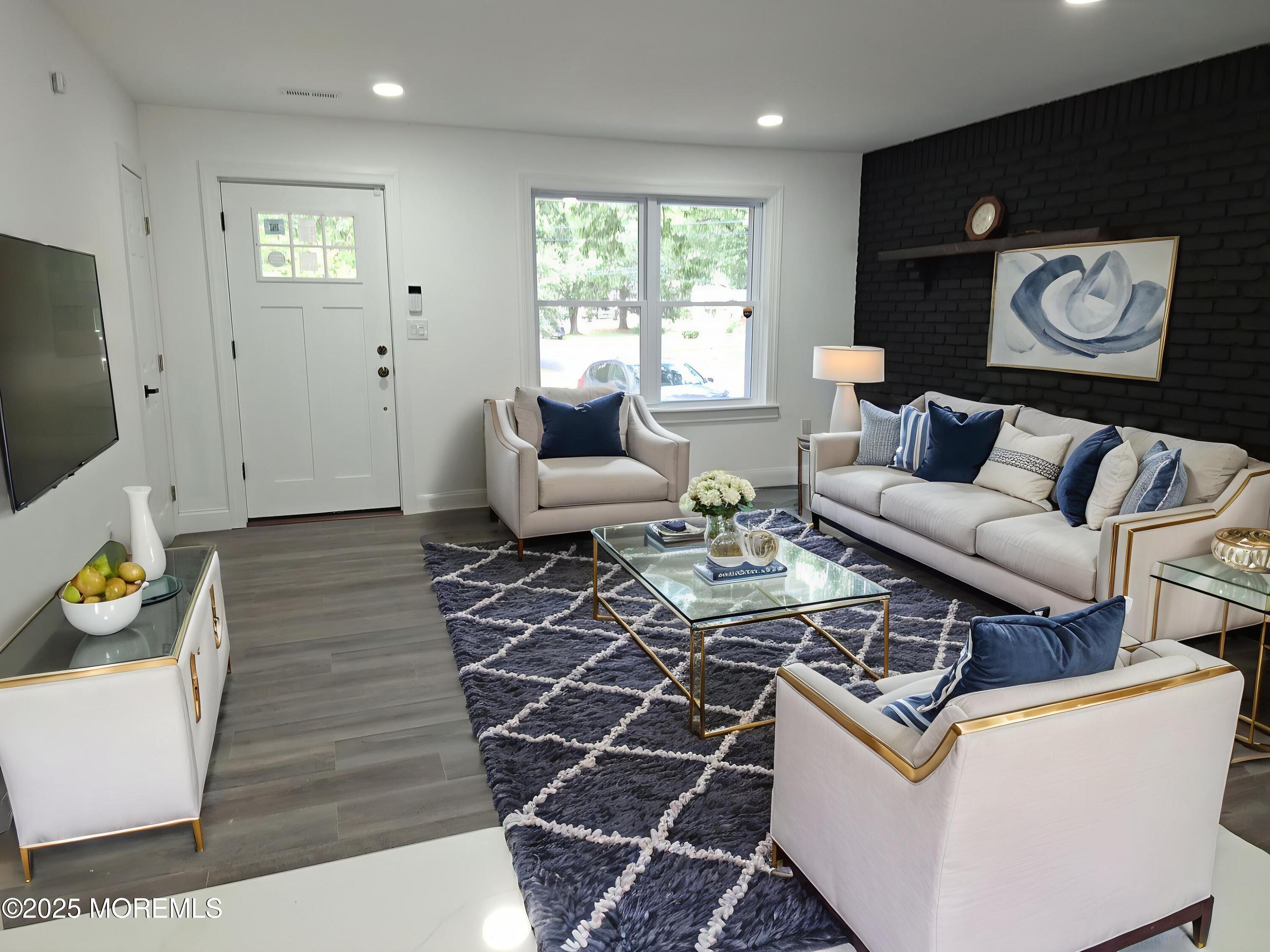 414 Oak Tree Road Freehold, NJ 07728 - Photo 10 of 25 a living room with furniture and a flat screen tv