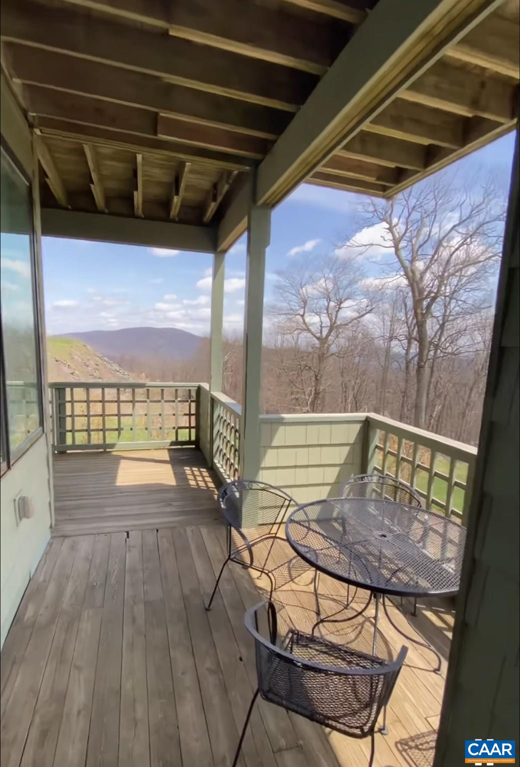 1722 High Ridge Roseland, VA 22967 - Photo 21 of 23 a view of a balcony with furniture and wooden floor