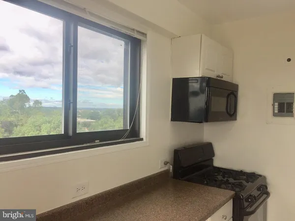 a view of an empty room and window