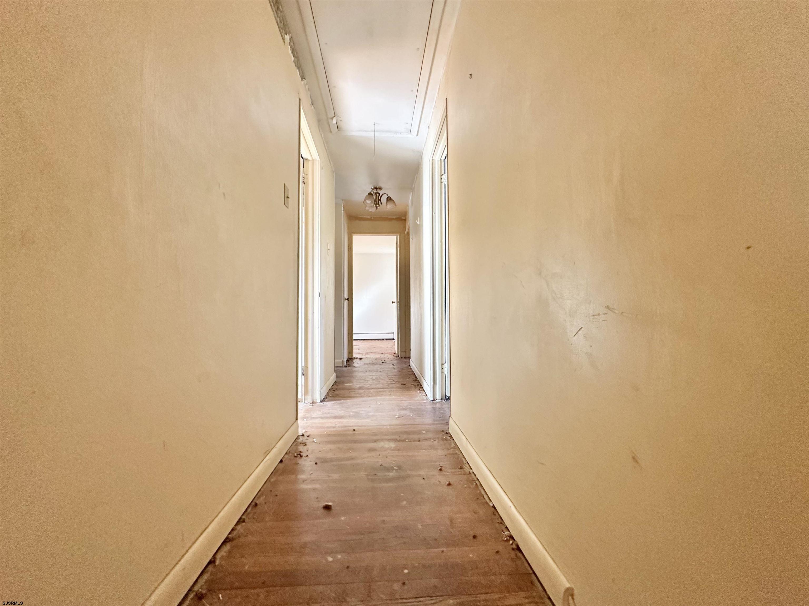 928 Traymore Parkway Absecon, NJ 08201 - Photo 11 of 25 a view of a hallway with wooden floor