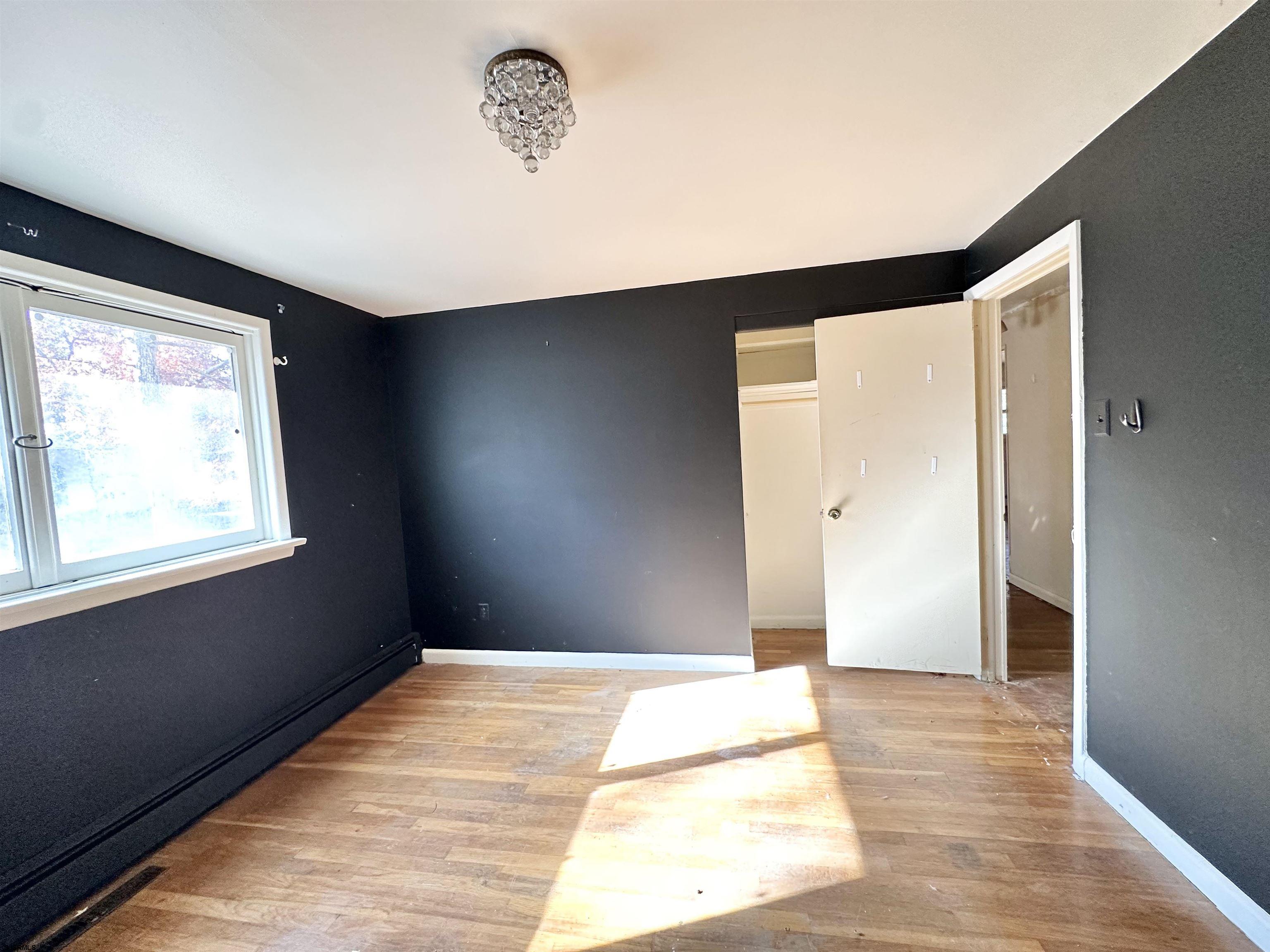 928 Traymore Parkway Absecon, NJ 08201 - Photo 21 of 25 a bedroom with a bed and a window