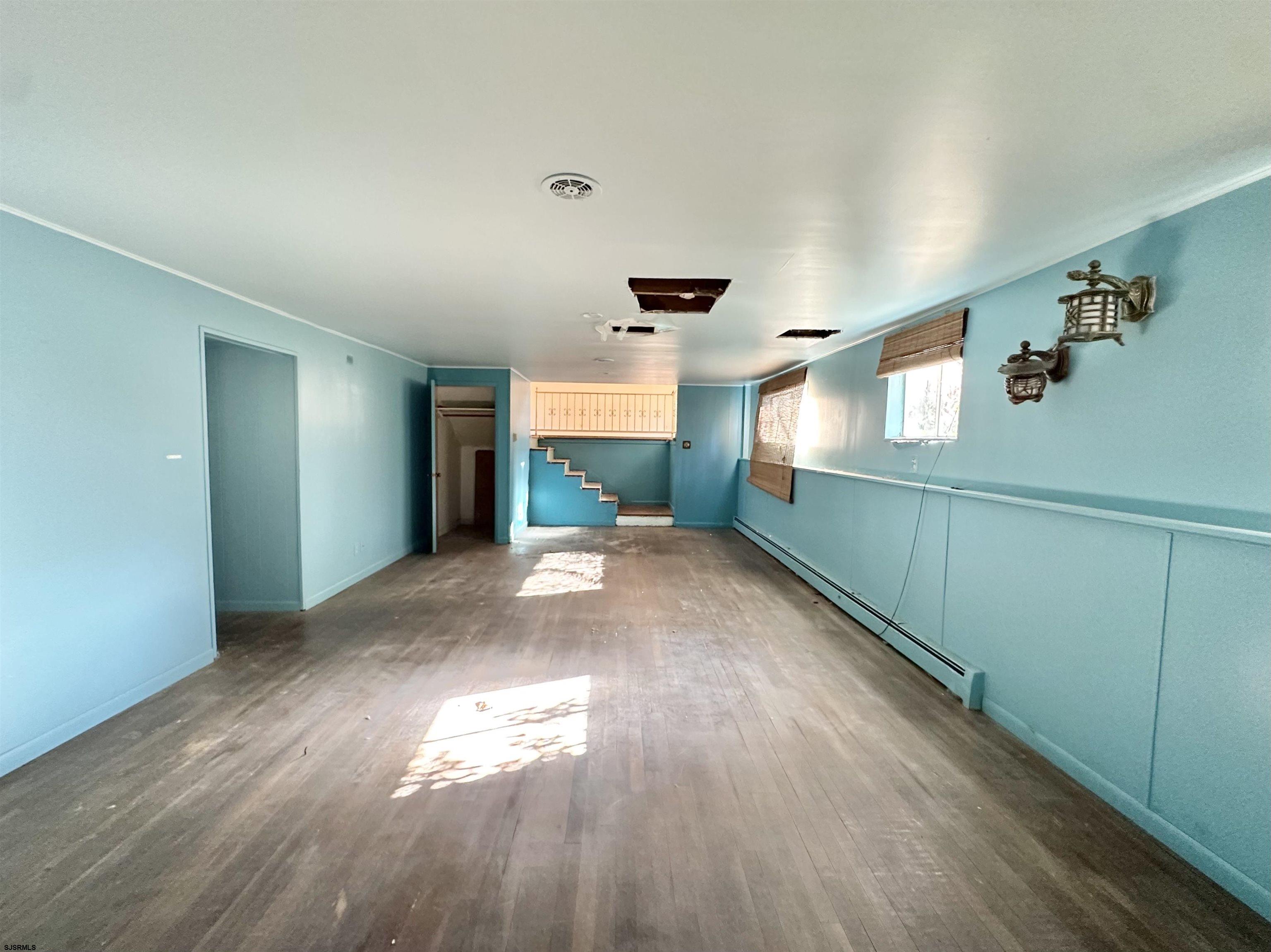 928 Traymore Parkway Absecon, NJ 08201 - Photo 22 of 25 a view of empty room with wooden floor