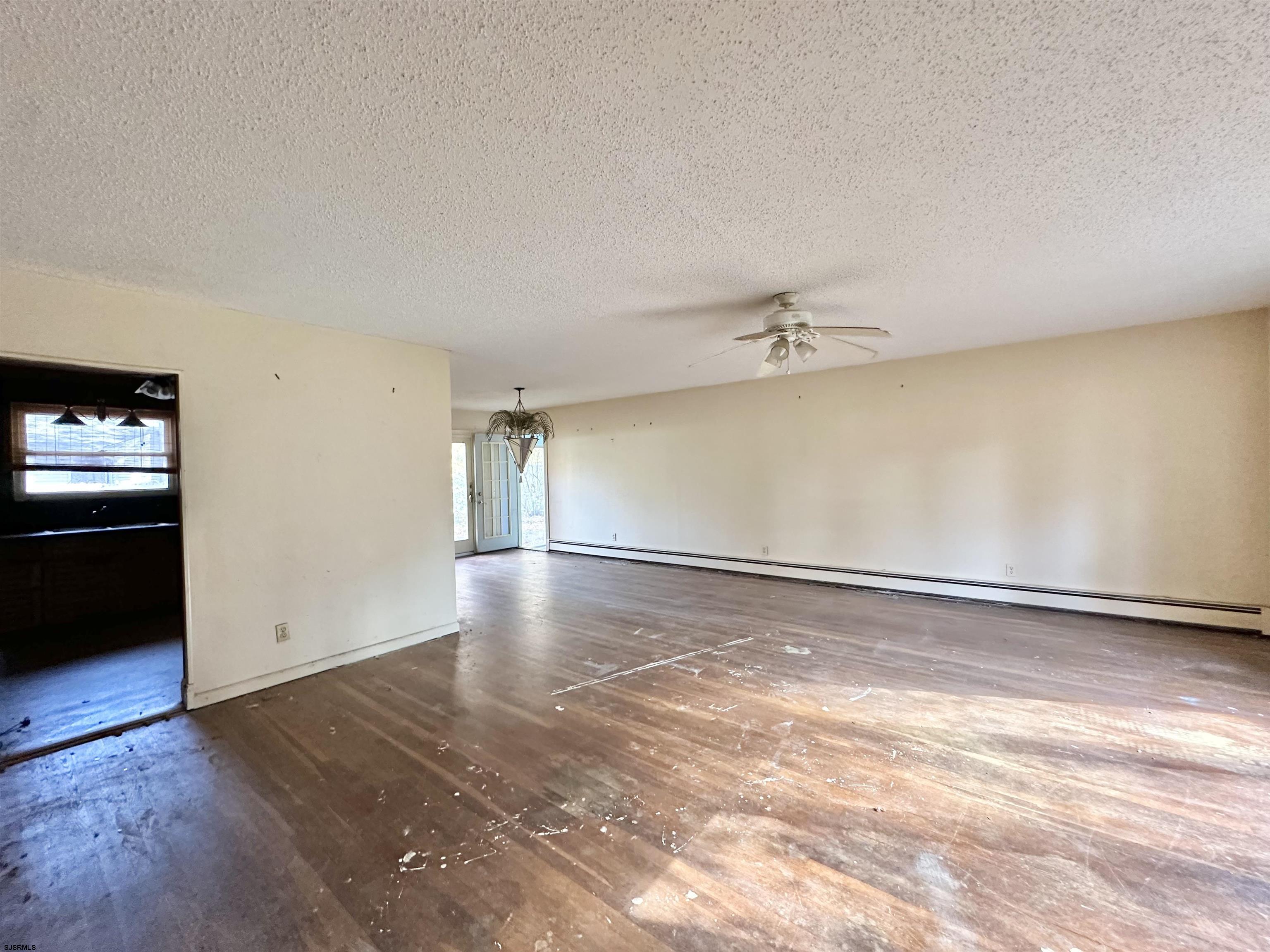 928 Traymore Parkway Absecon, NJ 08201 - Photo 3 of 25 wooden floor in an empty room