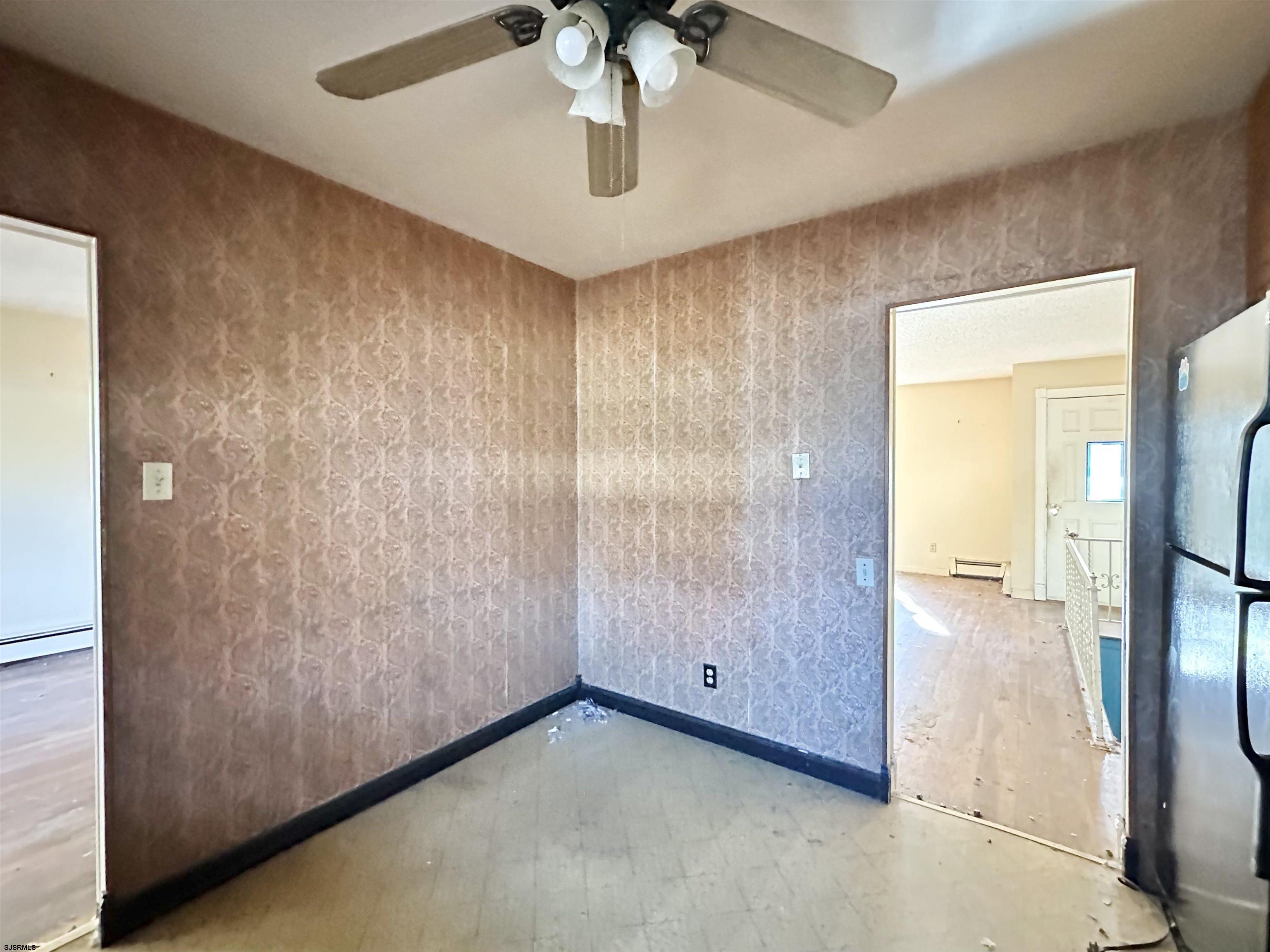 928 Traymore Parkway Absecon, NJ 08201 - Photo 8 of 25 a view of a hallway with a chandelier
