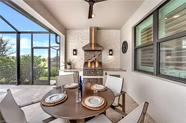 a view of a dining room with furniture window and outside view