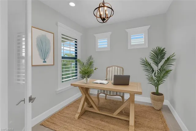 a workspace with furniture and window