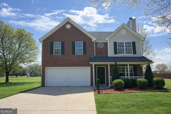 front view of a house with a yard