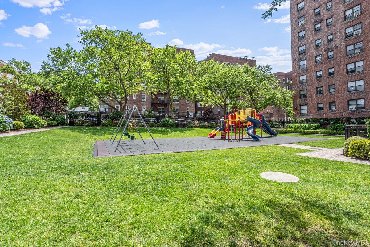 99-40 63rd Road, Unit 1Z Queens, NY 11374 - Photo 23 of 25 Communal playground featuring a yard