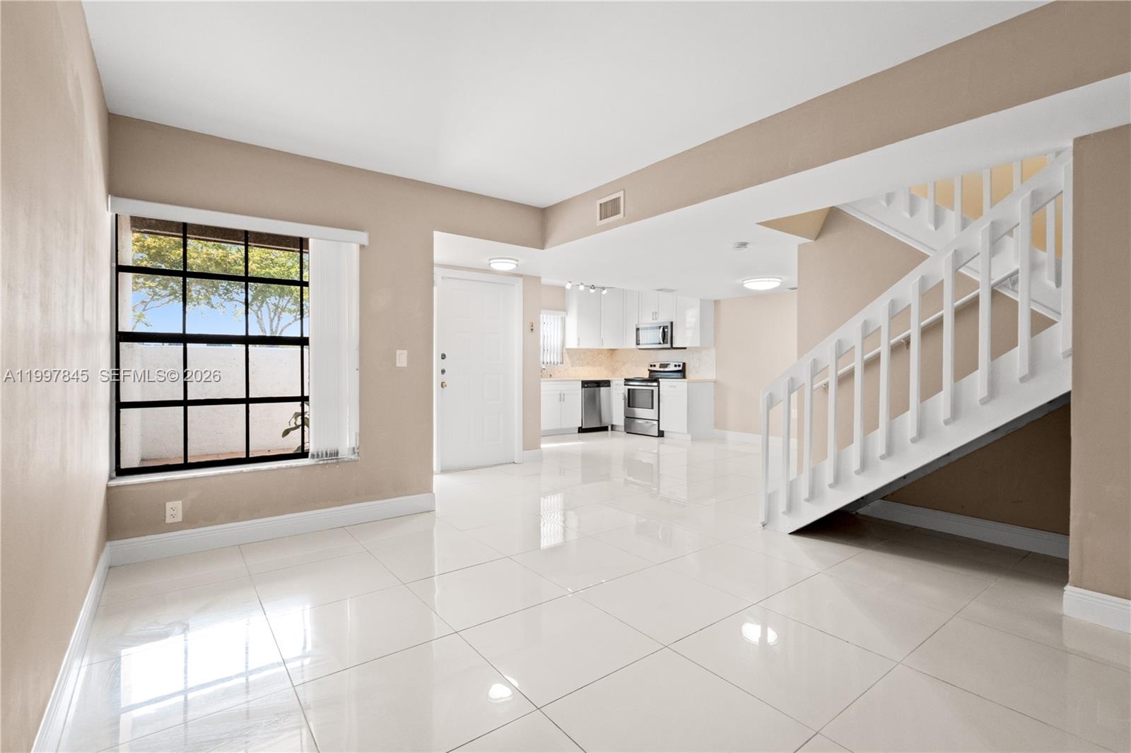 6211 Southwest 138th Court, Unit B Miami, FL 33183 - Photo 8 of 27 a view interior of a house with an entryway and stairs