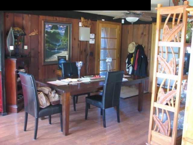 830 West Kuiaha Road Haiku, HI 96708 - Photo 11 of 15 a view of a dining room with furniture and a chandelier
