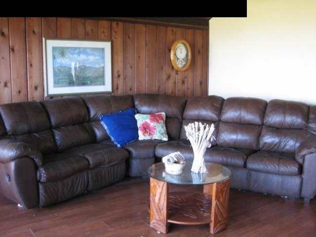 830 West Kuiaha Road Haiku, HI 96708 - Photo 9 of 15 a living room with furniture a clock and a window