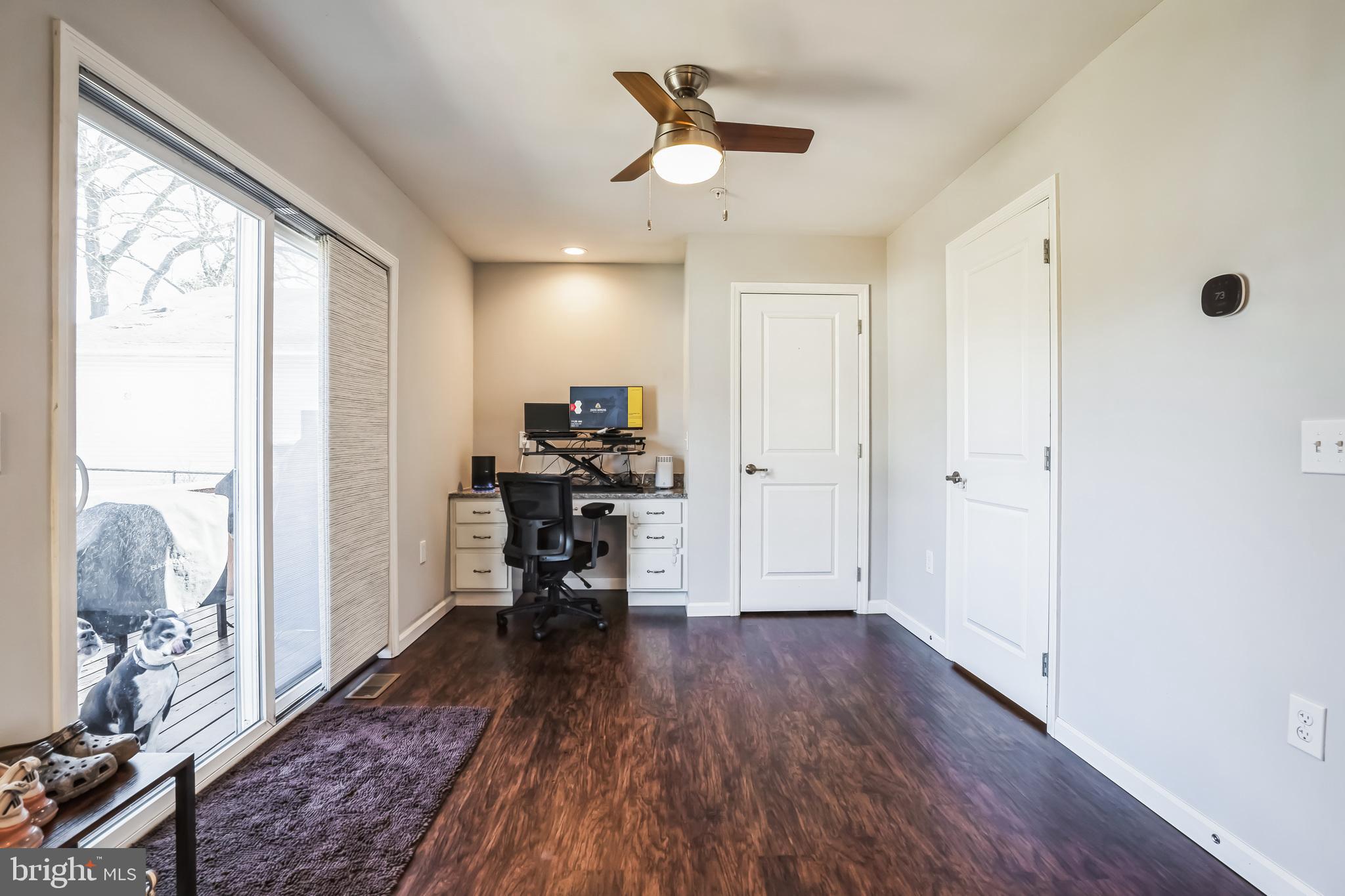 910 Rosedale Avenue Rosedale, MD 21237 - Photo 11 of 41 a view of a livingroom with furniture a ceiling fan and front door