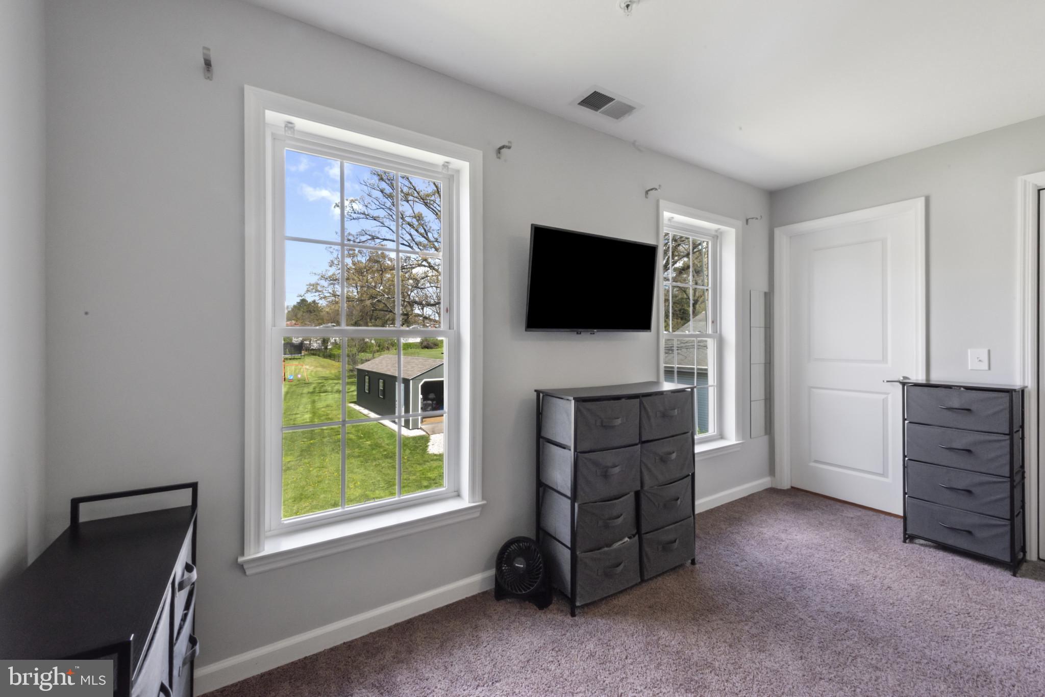 910 Rosedale Avenue Rosedale, MD 21237 - Photo 15 of 41 a living room with furniture and a flat screen tv