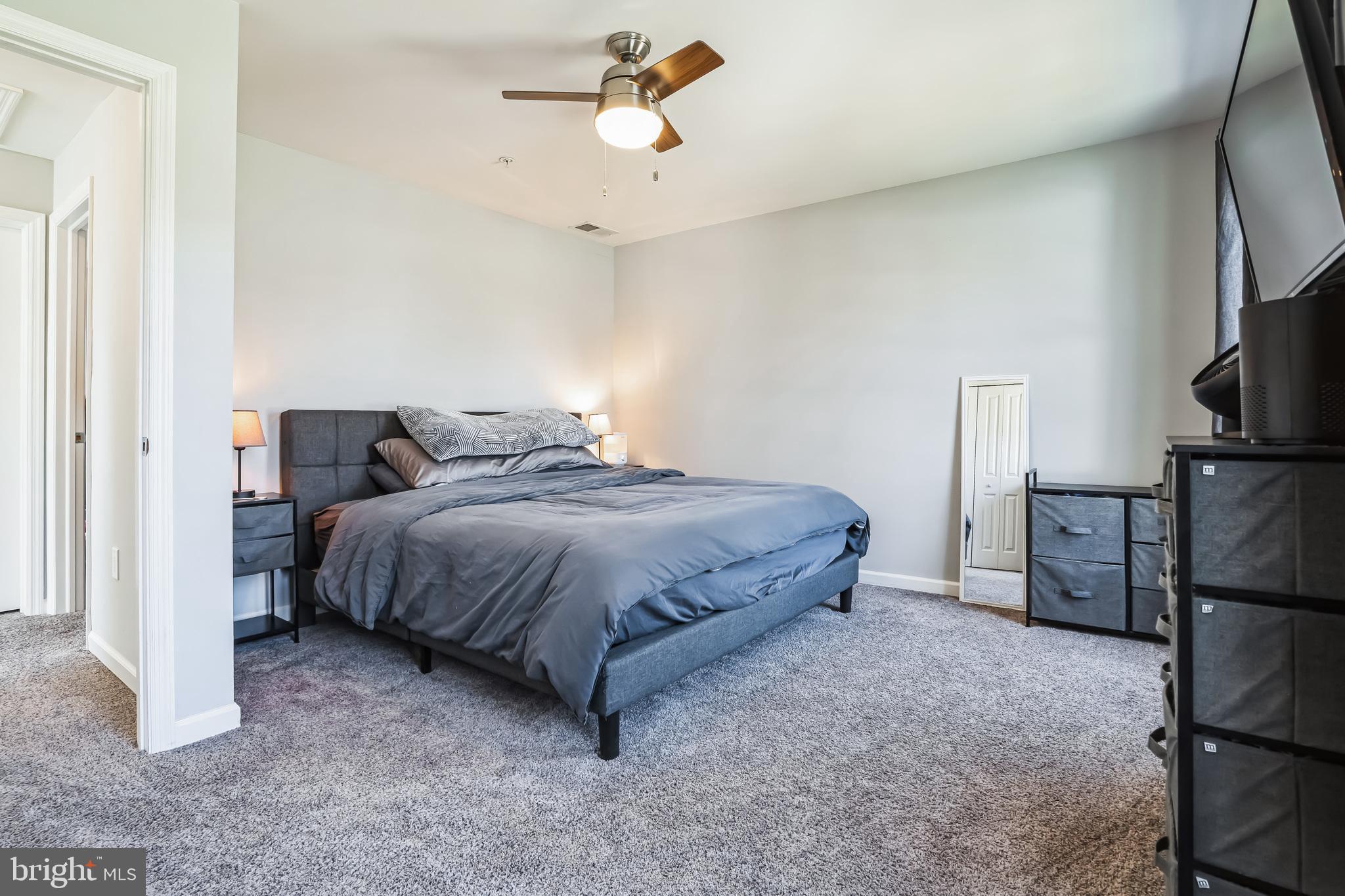 910 Rosedale Avenue Rosedale, MD 21237 - Photo 16 of 41 a bedroom with a bed and a flat screen tv