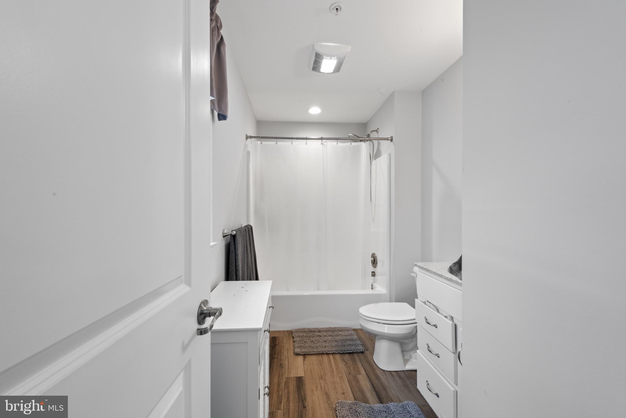 910 Rosedale Avenue Rosedale, MD 21237 - Photo 18 of 41 a bathroom with a toilet a sink and a shower