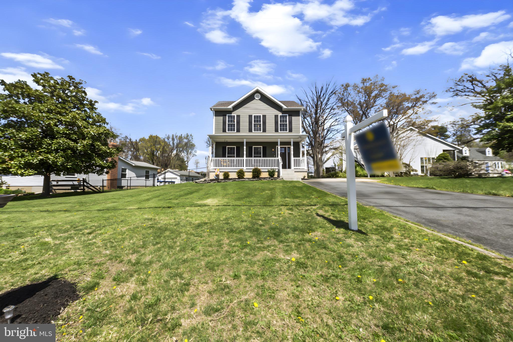 910 Rosedale Avenue Rosedale, MD 21237 - Photo 2 of 41 a house with green field in front of it