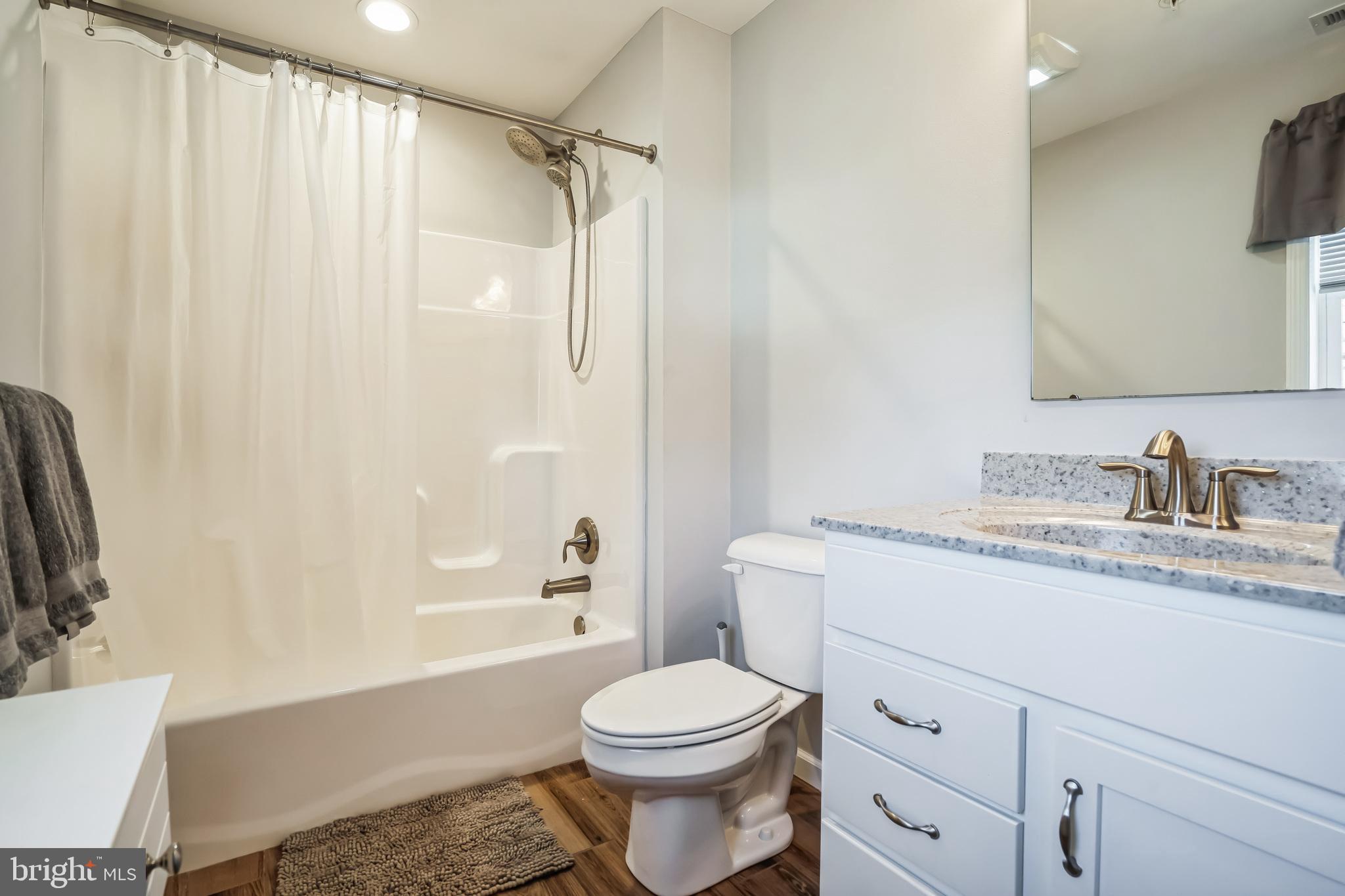 910 Rosedale Avenue Rosedale, MD 21237 - Photo 21 of 41 a bathroom with a sink toilet and shower