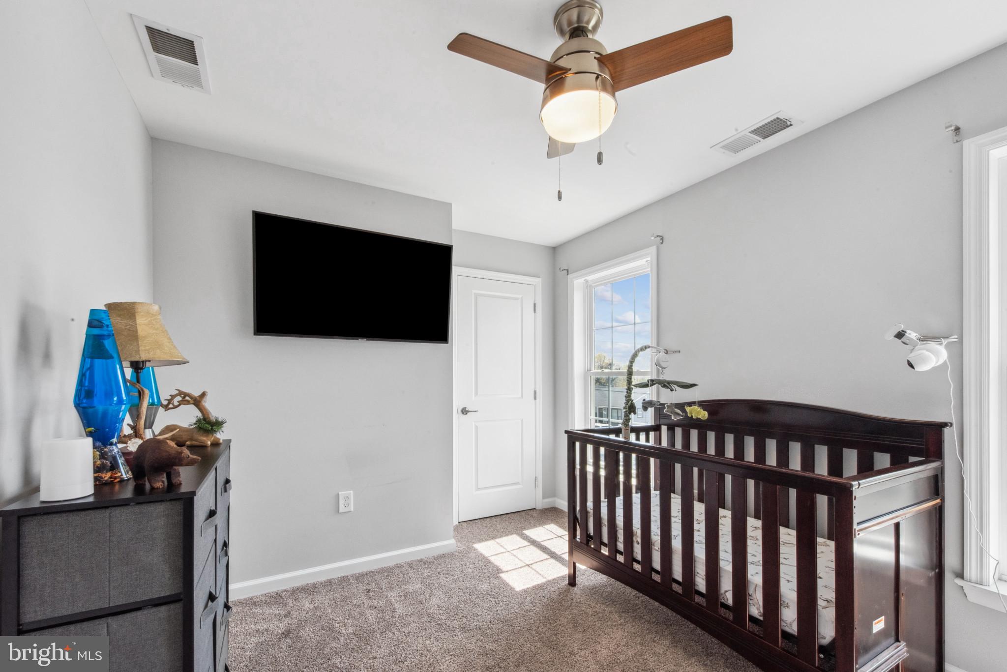 910 Rosedale Avenue Rosedale, MD 21237 - Photo 23 of 41 a view of a livingroom with furniture and a flat screen tv